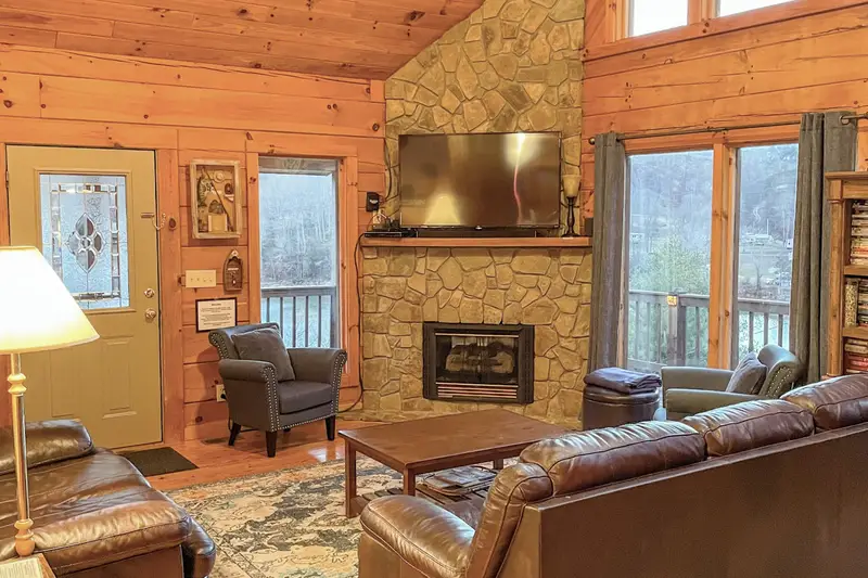 Living room with flat-screen TV and lake views