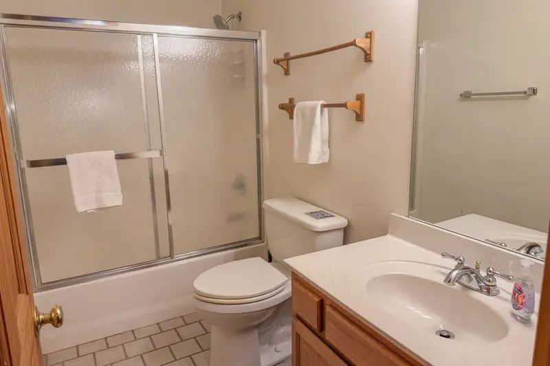 Upstairs bathroom with tub and shower combination