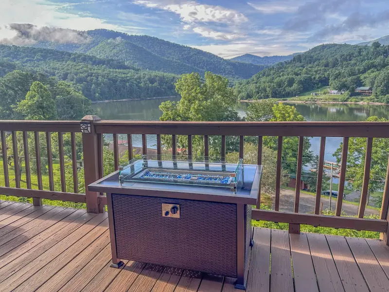 Gas fire table on the deck overlooking the lake
