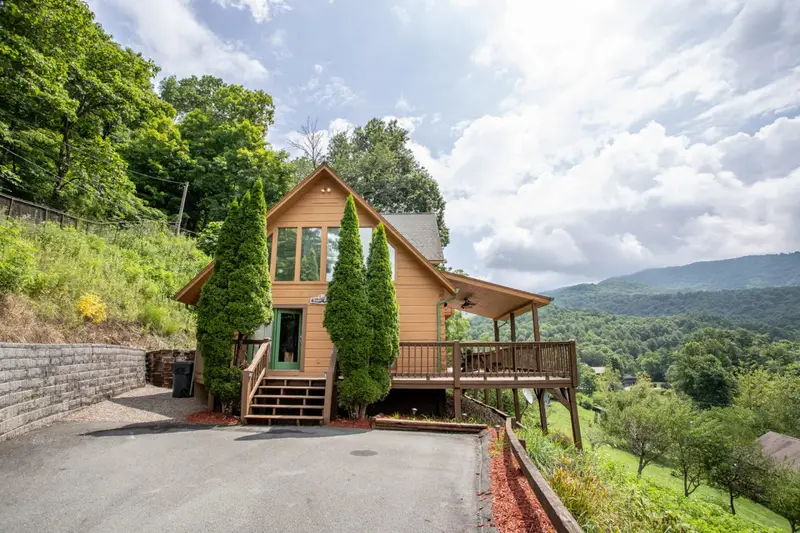 Cabin exterior and deck from the driveway