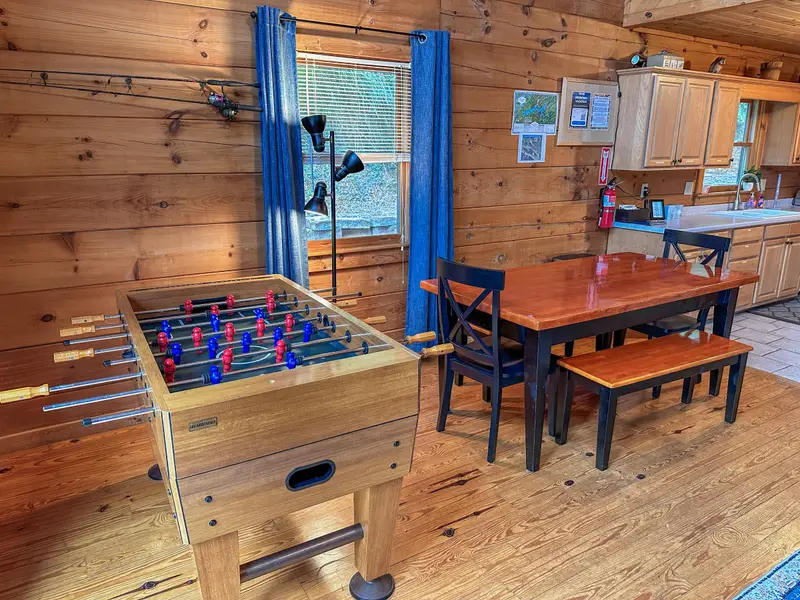Foosball table and dining area with bench seating