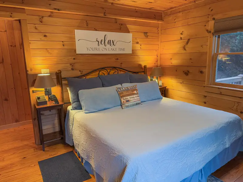 Primary king bedroom with lake-themed decor