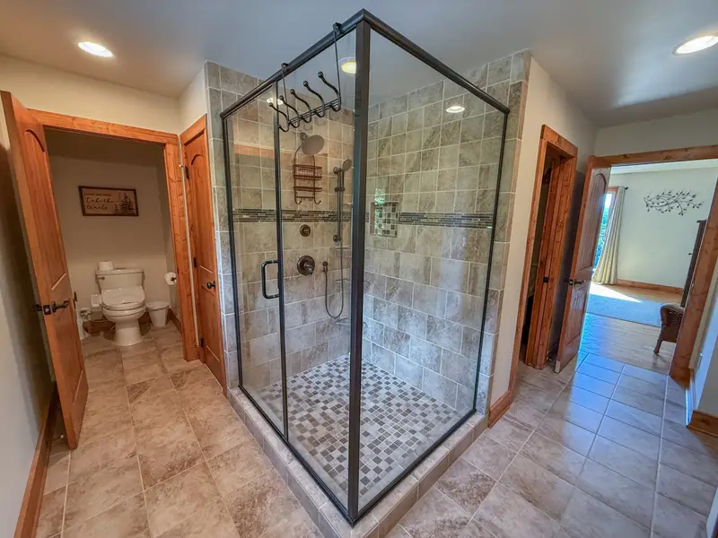 Large tile shower and luxury bidet in the primary bath