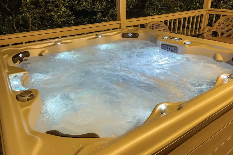 Luxury hot tub on the lower deck at night
