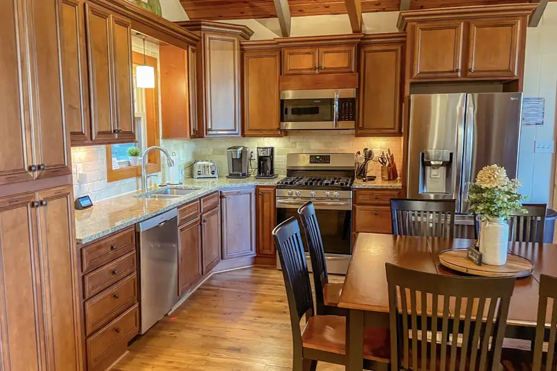 Fully stocked main kitchen with stainless appliances and gas range