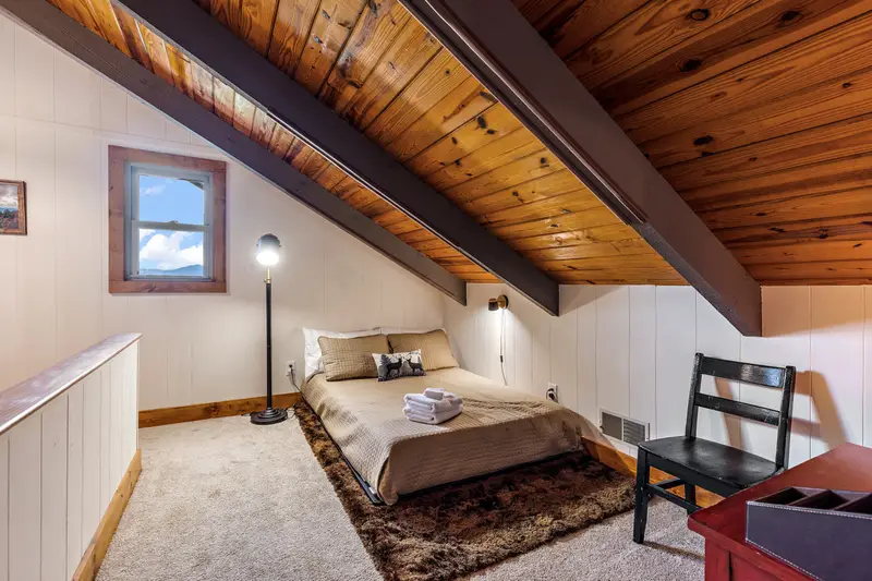 Top-level loft with full bed and TV