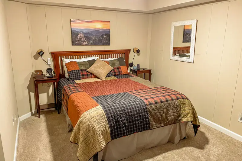 Queen bedroom with access to the screened porch