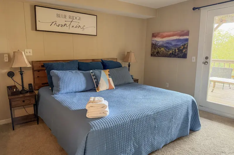 Lower-level king bedroom with mountain decor