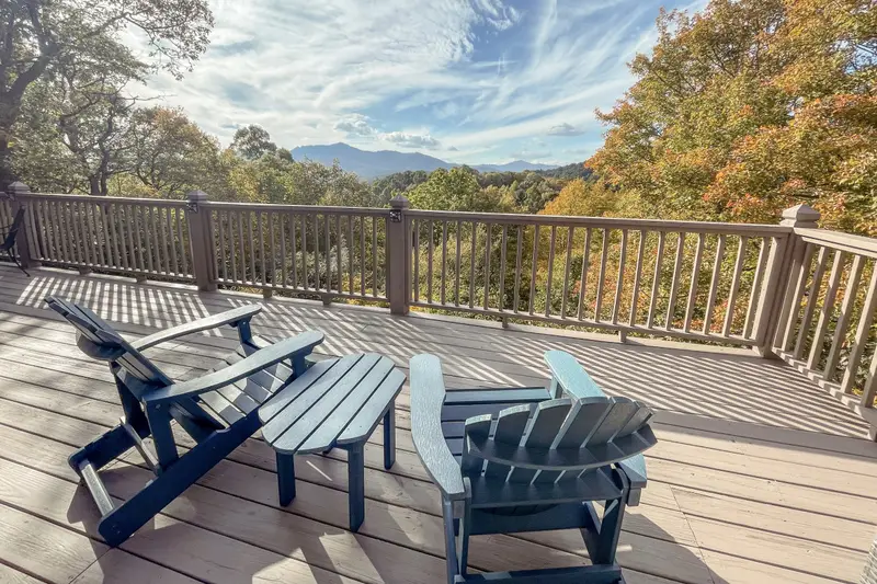 Main deck with Adirondack chairs and mountain views