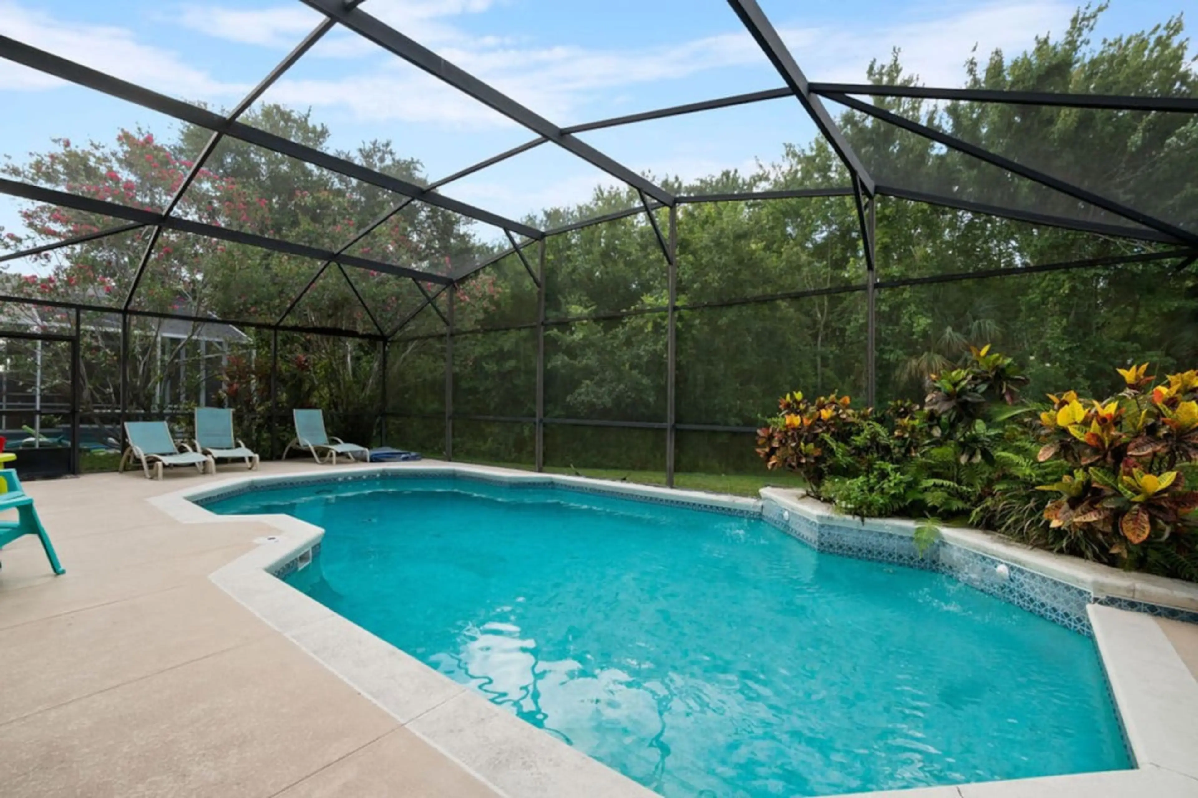 Private screened patio and swimming pool area