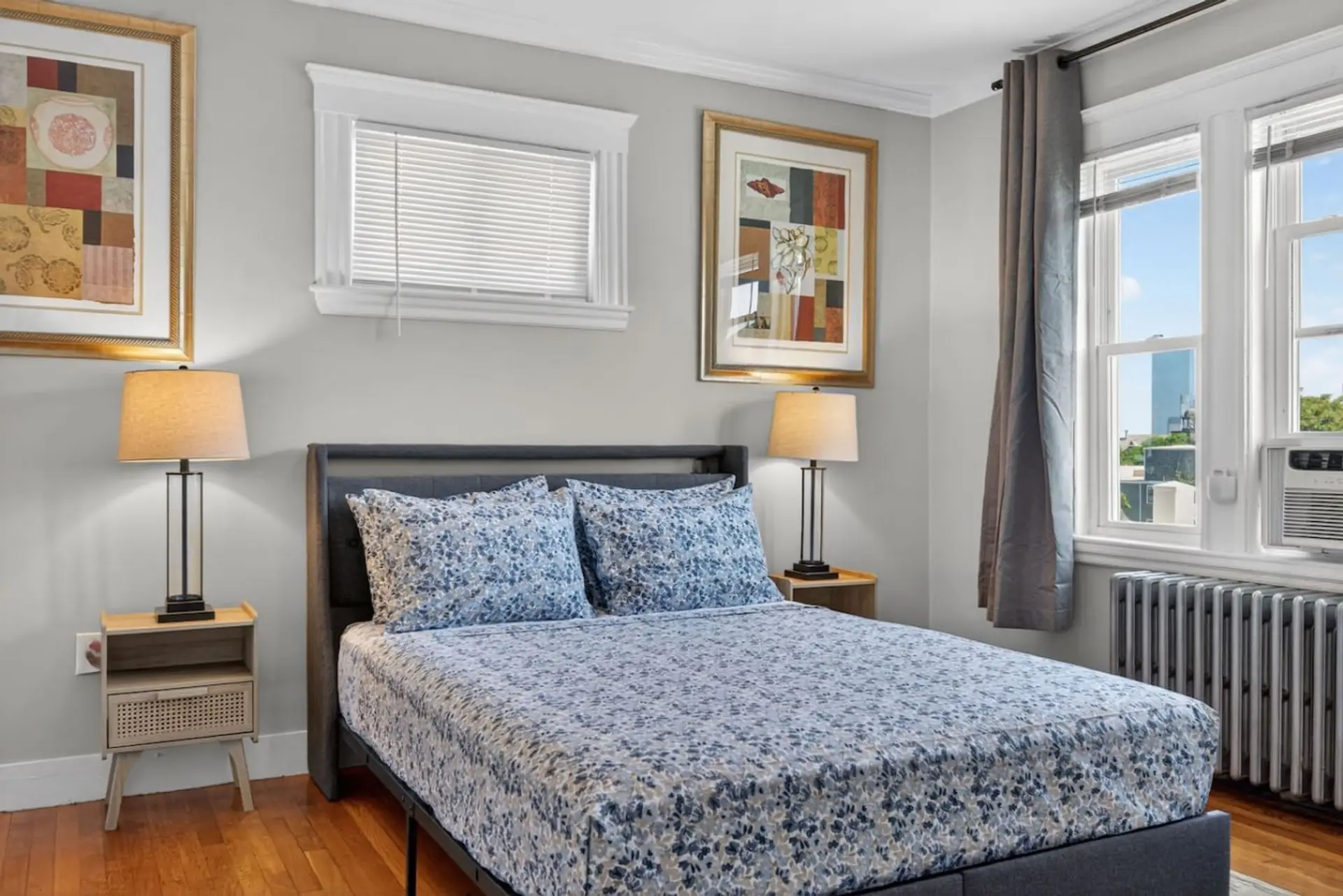 Queen bedroom with skyline views from the window.