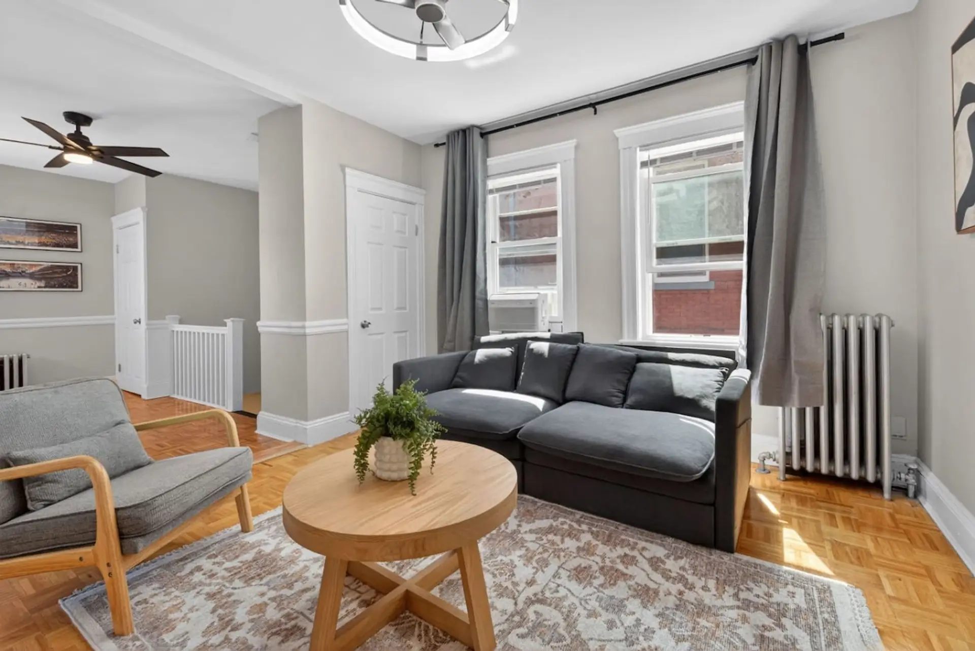 Bright living room with comfortable seating and plenty of natural light.