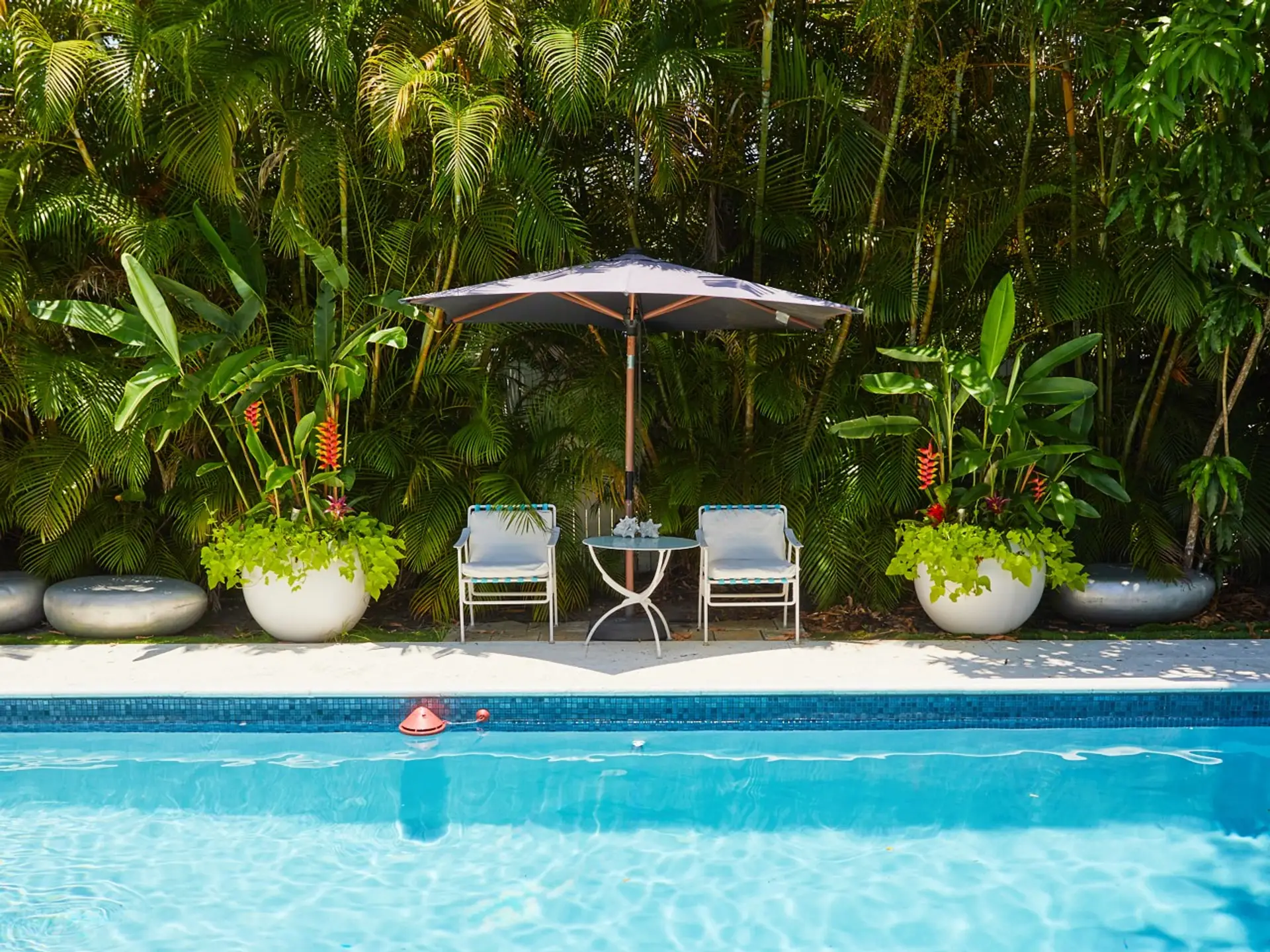Enjoy a quiet sitting area by the stunning pool. It's a perfect place to read that book you always wanted to finish…