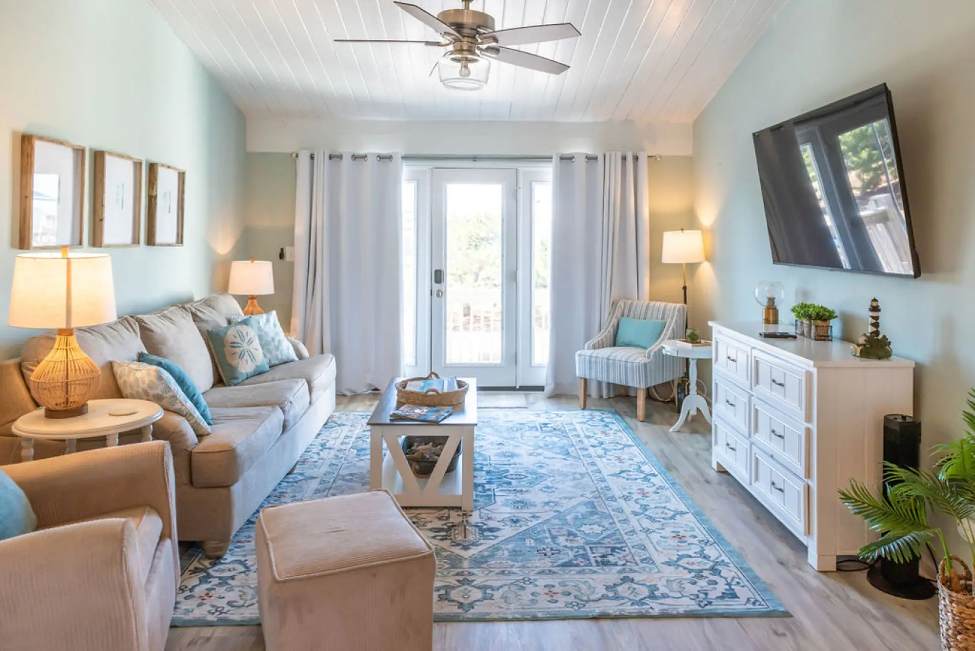 Relax and reconnect in this bright coastal living room after a day at the beach