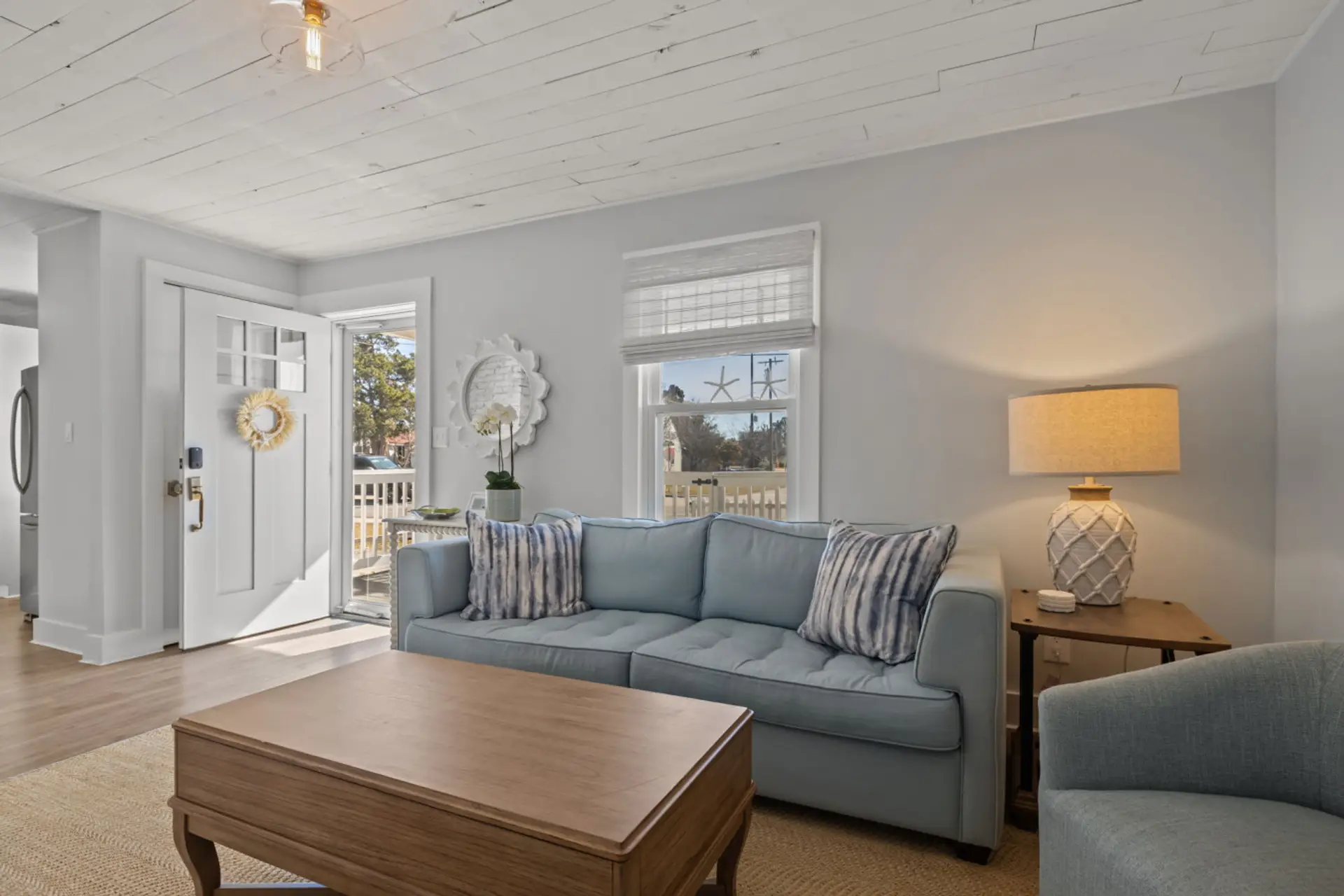 Cozy coastal vibes with natural light and soft comfortable spaces.