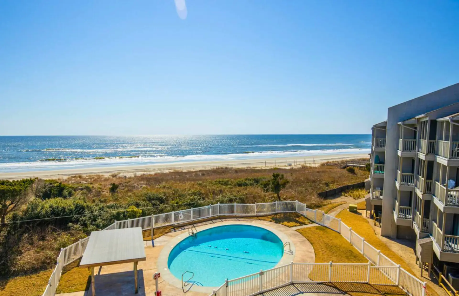 Enjoy the oceanfront pool with stunning beach views just steps from the shore