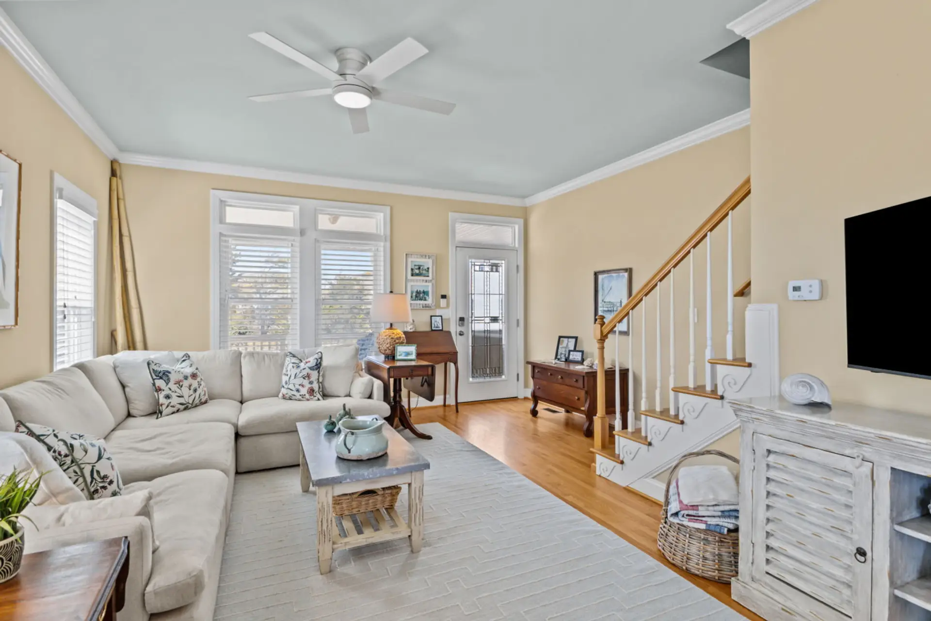 Spacious living area in Marsh House featuring cozy seating, modern decor, and easy access to entryway