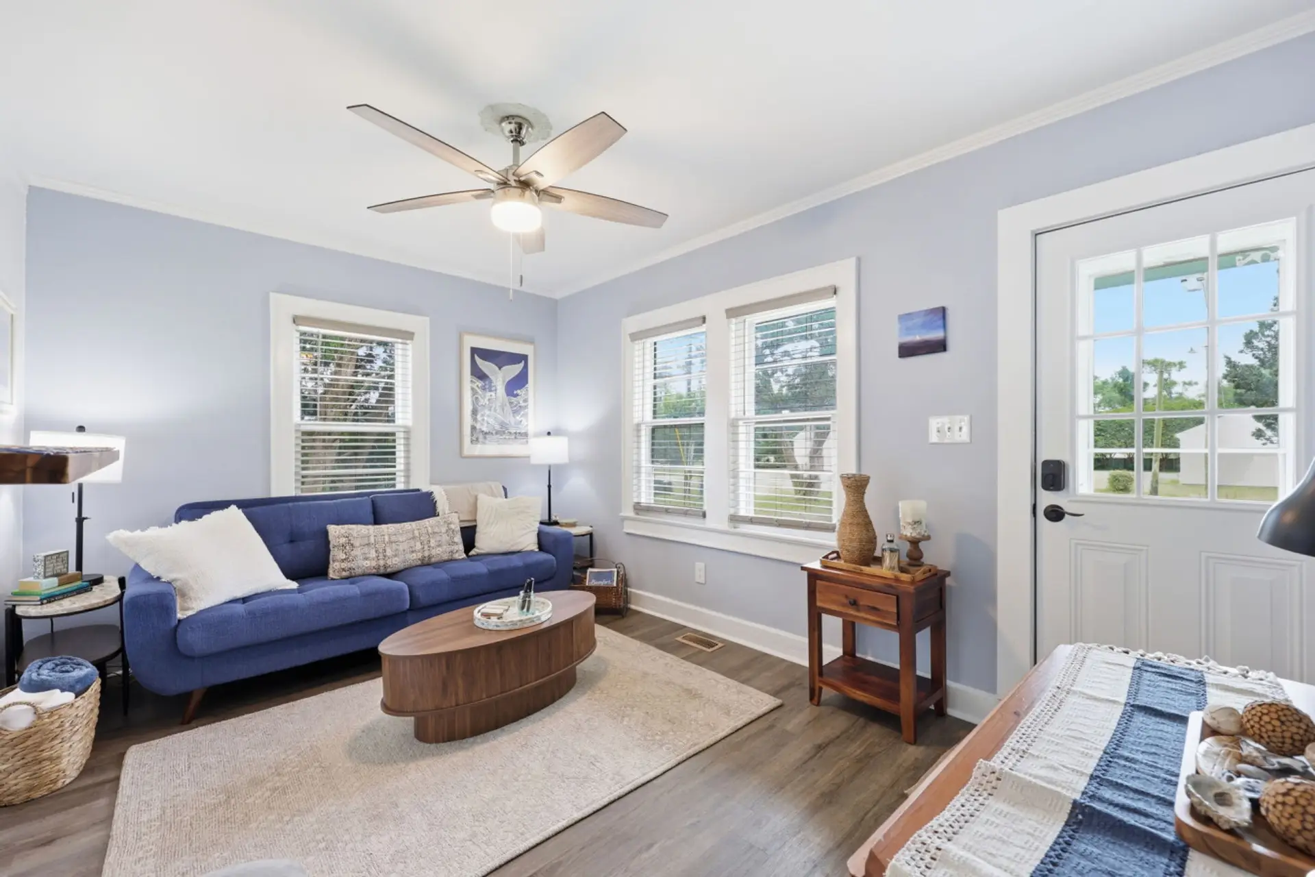 Bright and inviting living space with cozy seating and relaxing coastal cottage charm