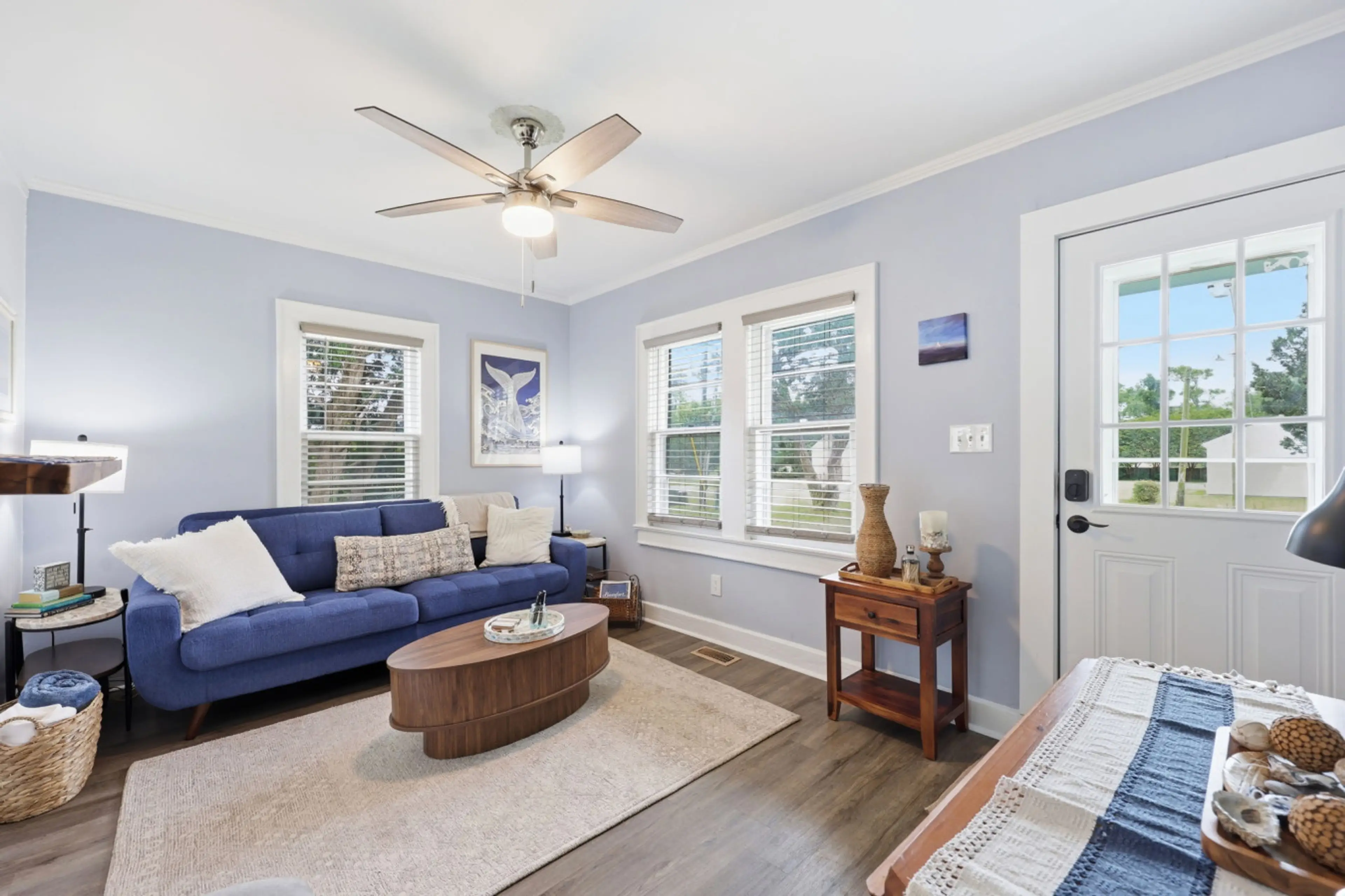 Bright and inviting living space with cozy seating and relaxing coastal cottage charm