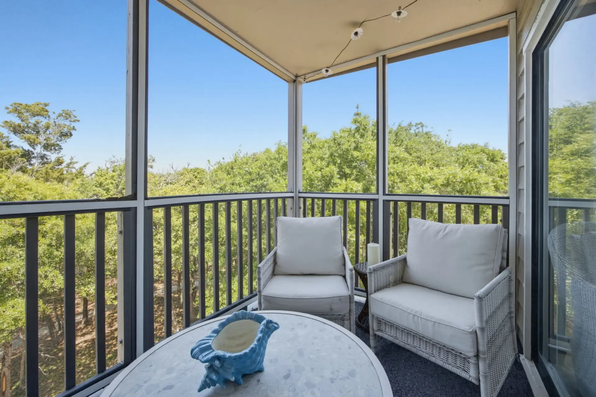 Enjoy morning coffee and breezy coastal views from the private screened balcony