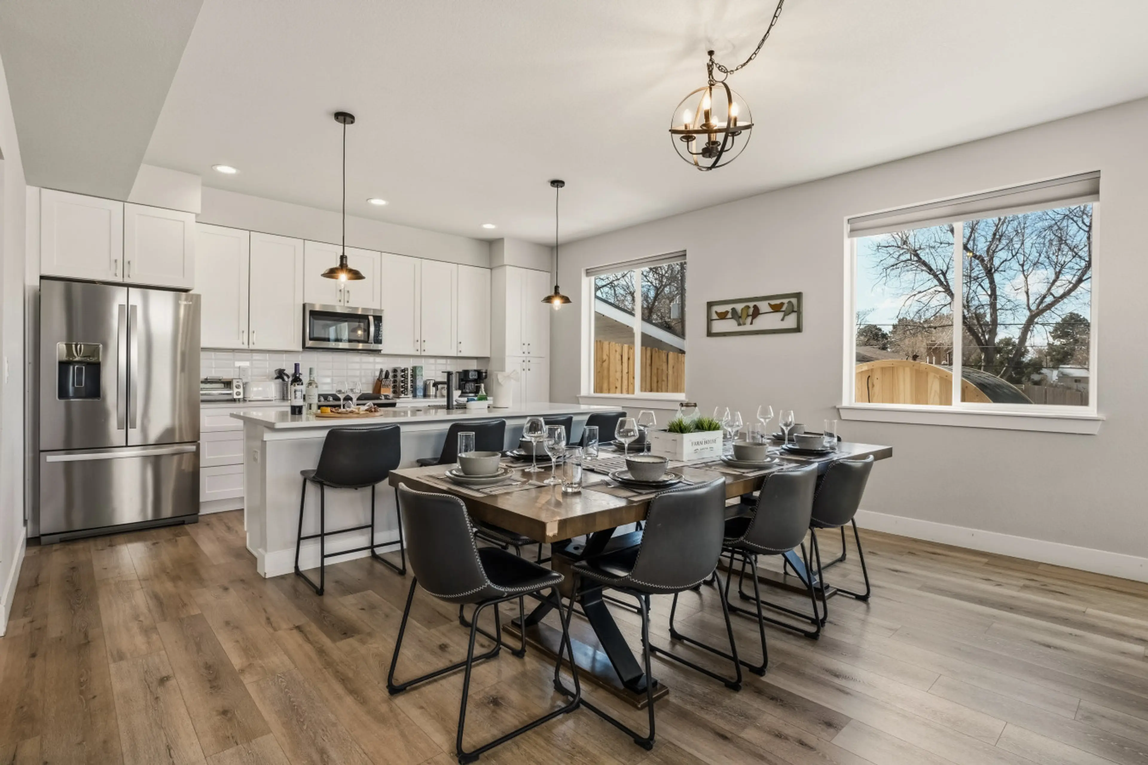 Dining table with seating for 8, and 4 more at the island