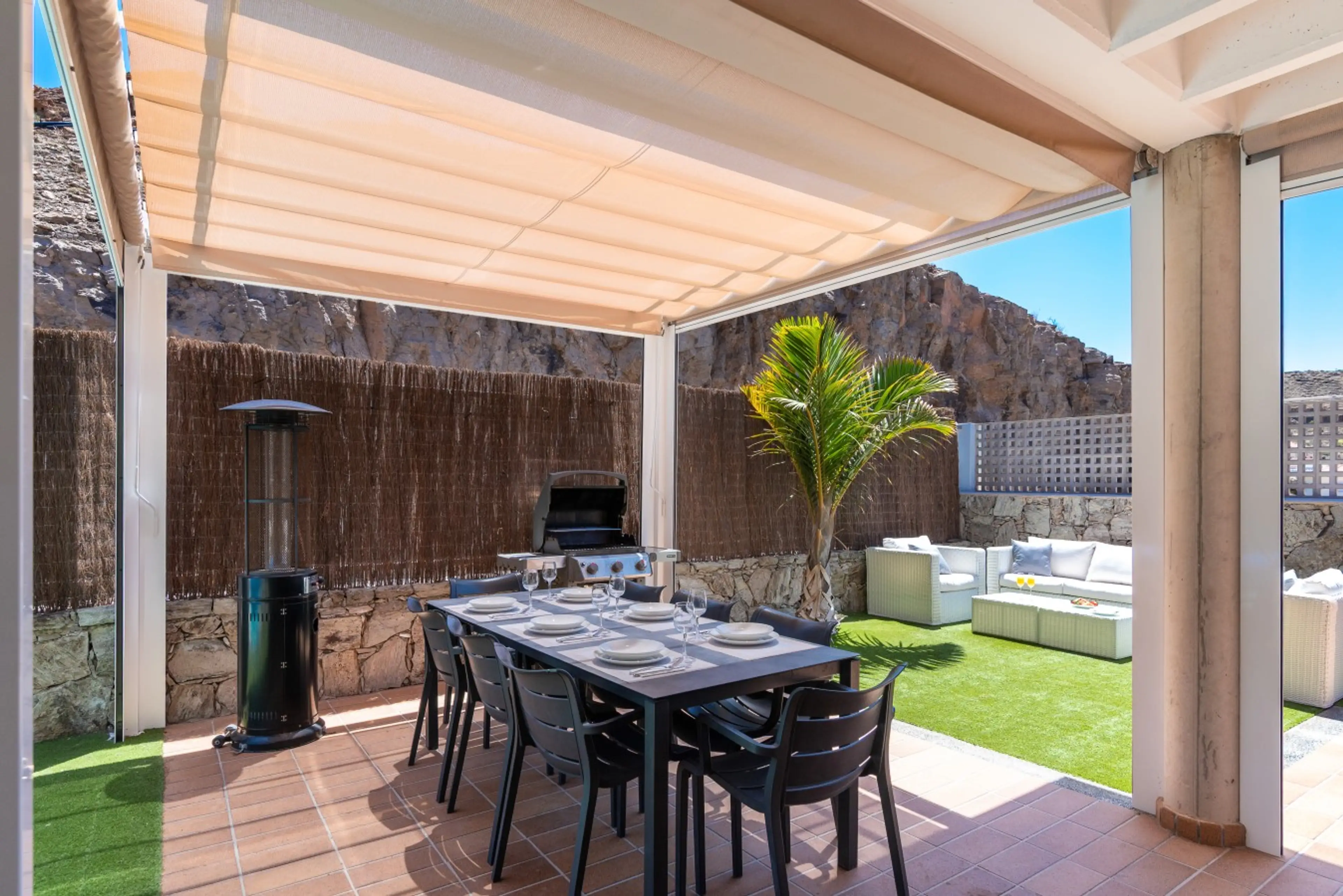 Exterior dining area with gas barbecue, heater and lounge