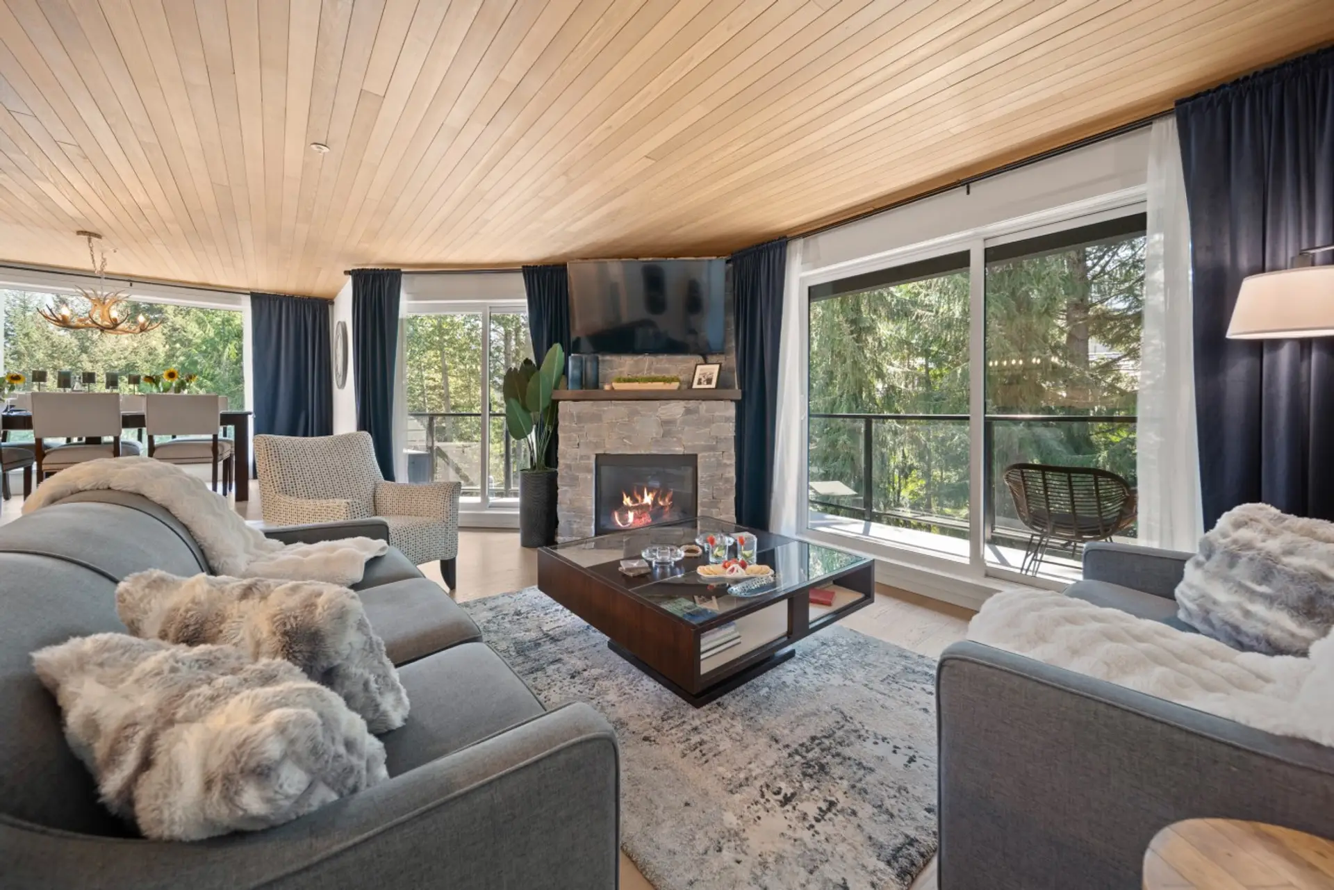 Bright living space with direct access to the balcony, which runs from the living room to the patio for seamless indoor-outdoor living.
