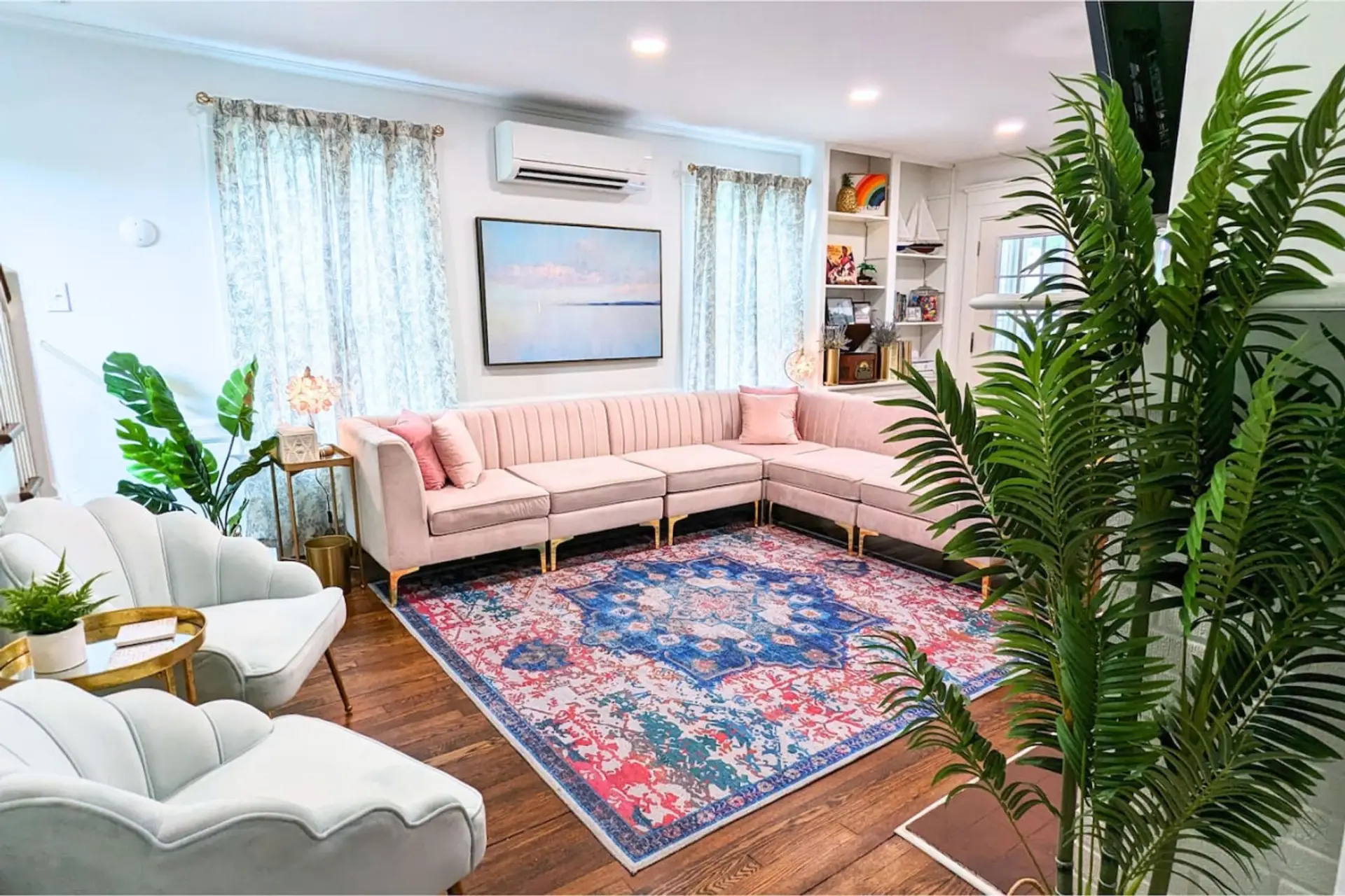 The beautiful living room is luxuriously decorated, embracing 1920s charm and coastal comfort.