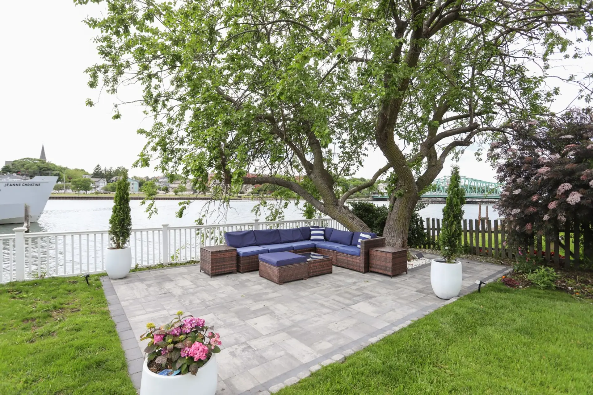 Our comfortable large outdoor couch has a beautiful view of the river and can fit the whole family