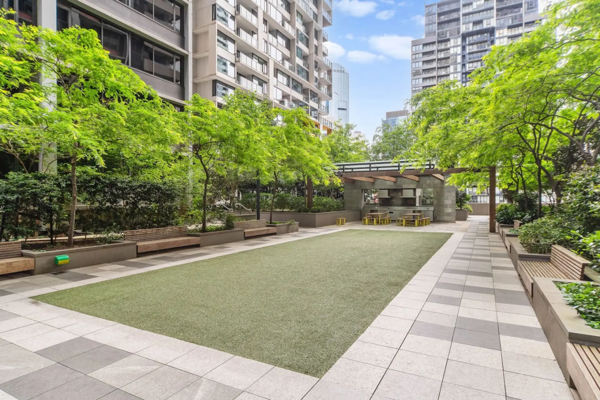 The award winning spacious garden roof top area complete with BBQ's, seating and walking paths to the level 6 Gym and Indoor pool.