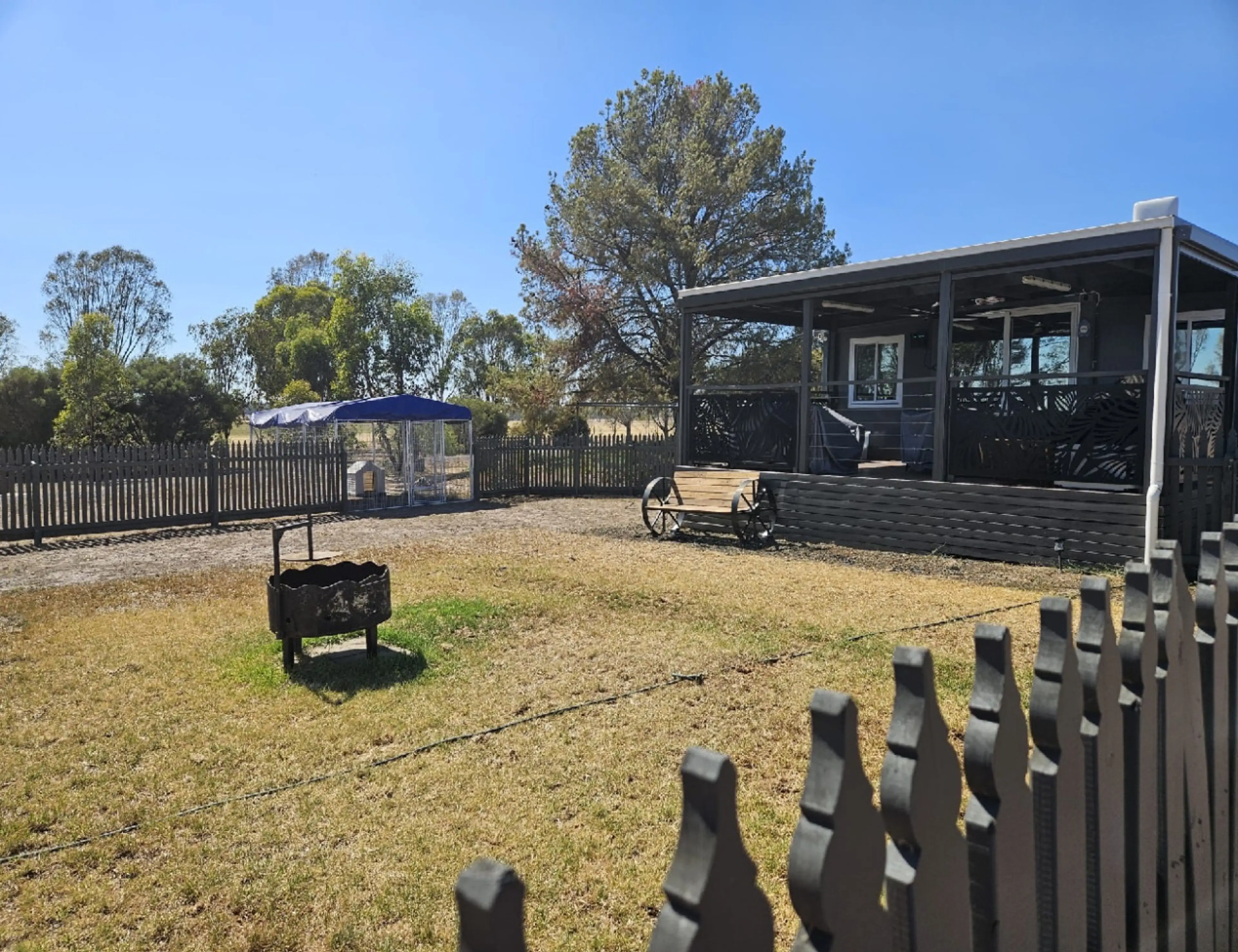 Fully Fenced yard with dog cage if required