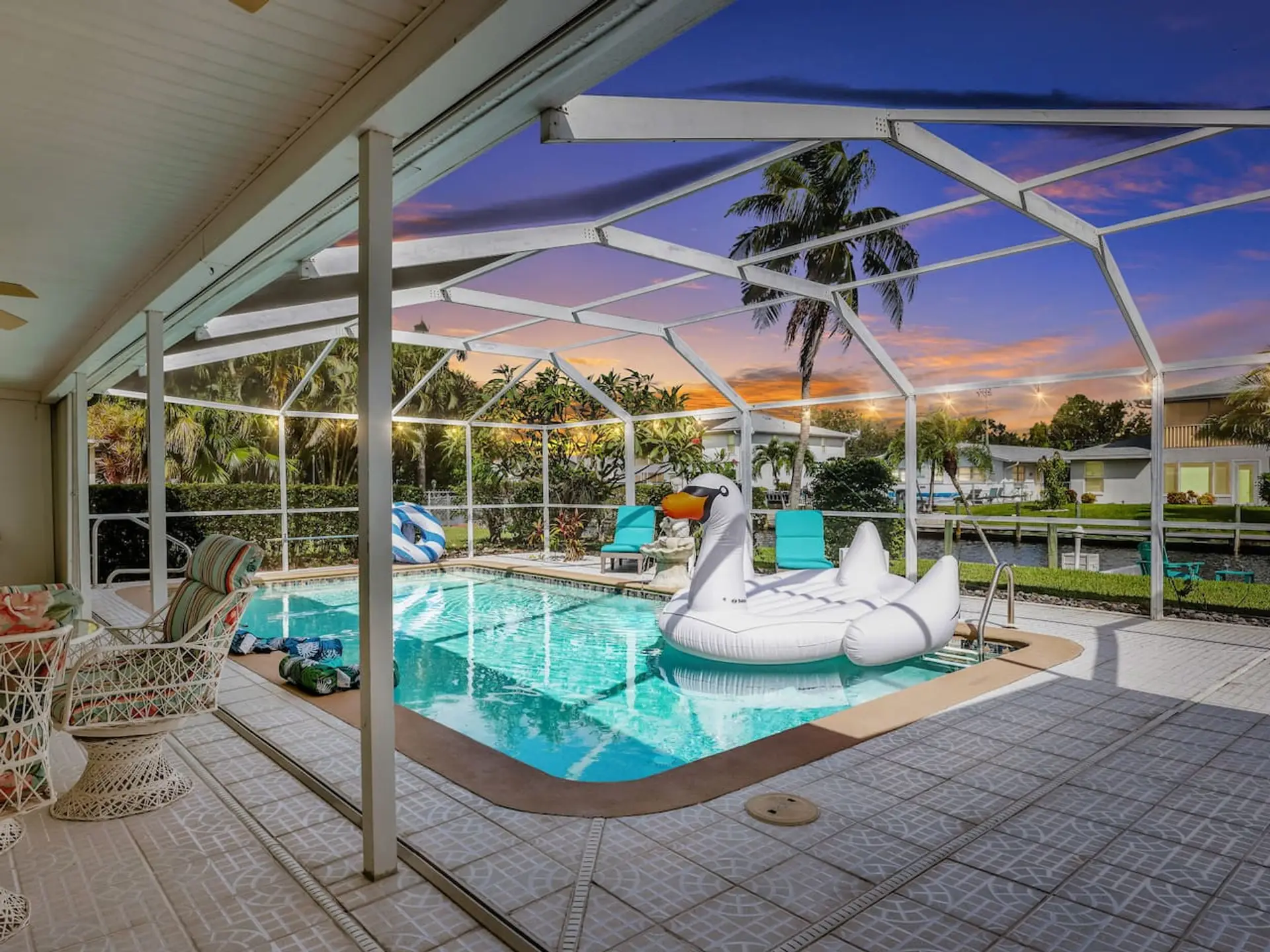 View of the pool, canal, and seating area