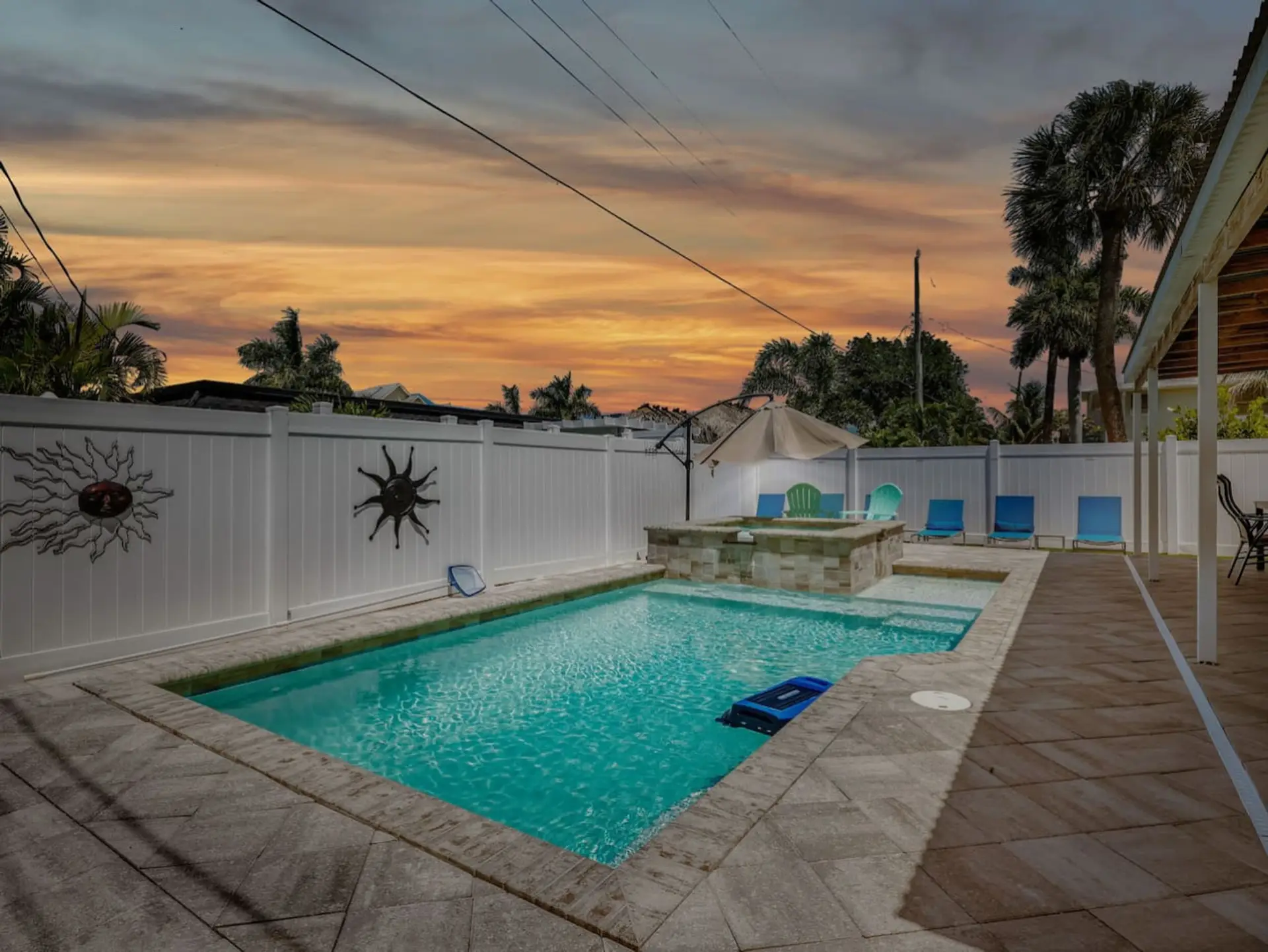 Enjoy peaceful evenings by your private pool, complete with lounge chairs and beautiful sunset views.
