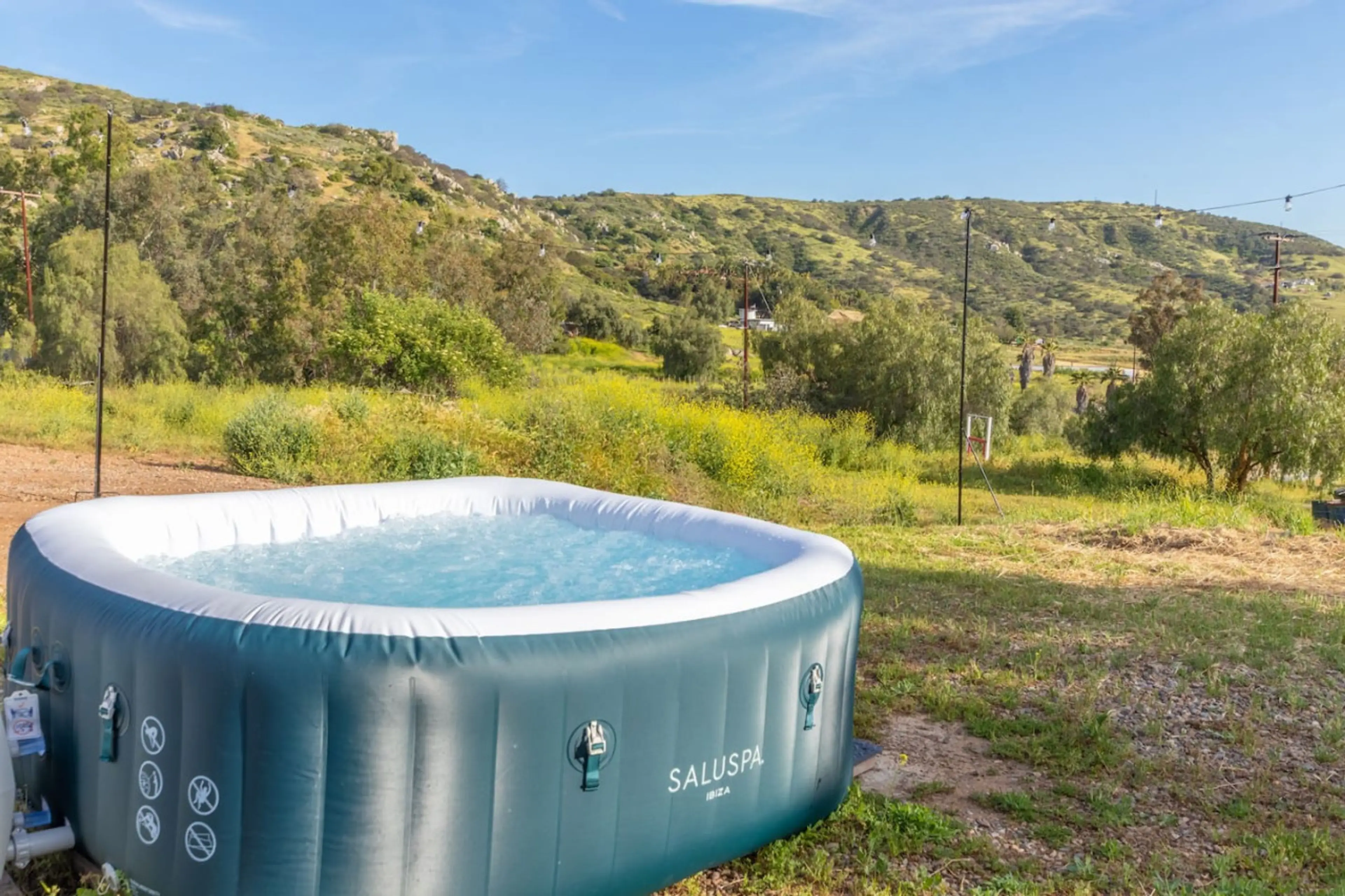 Hot Tub Oasis: Soak under the stars with breathtaking views in your own private retreat!