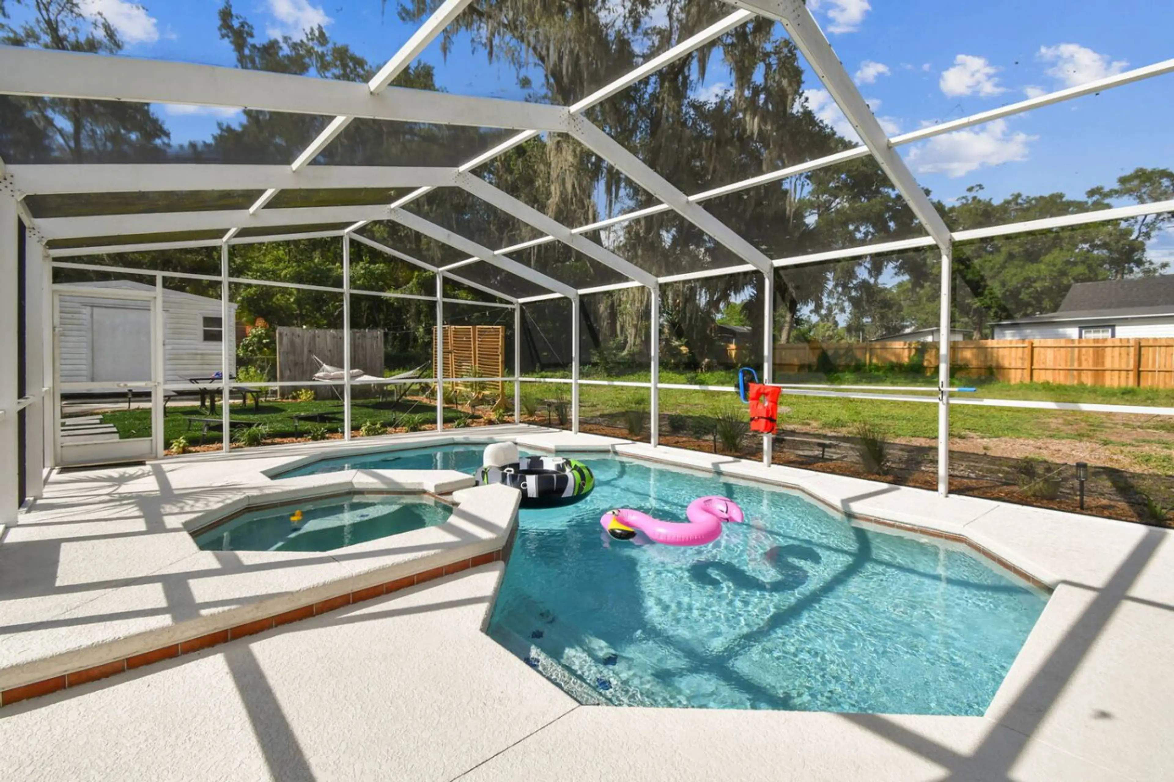 Poolside Fun: Splash into relaxation in this screened oasis, complete with colorful floats and sunshine!