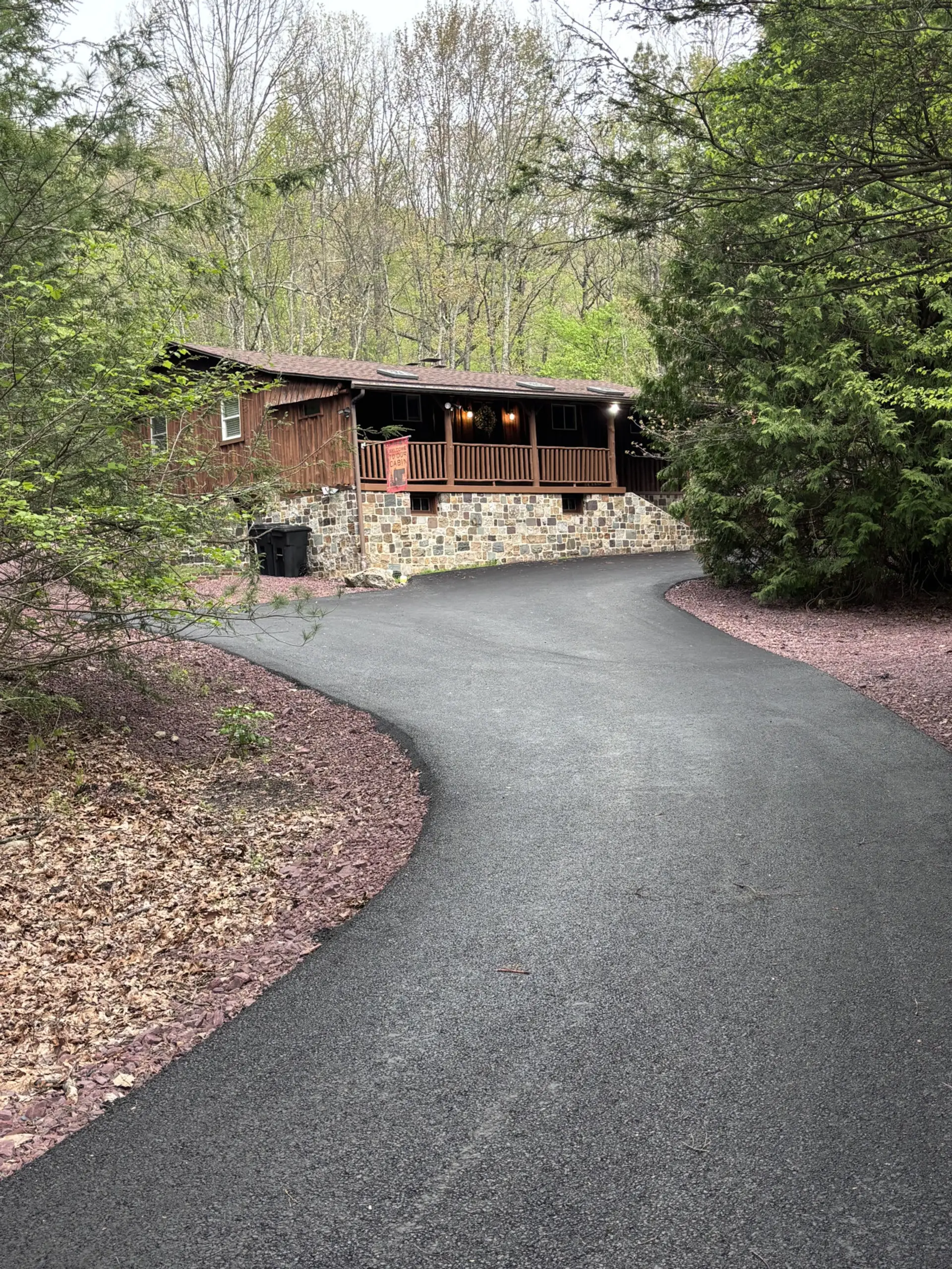 Paved driveway leading to the cabin
