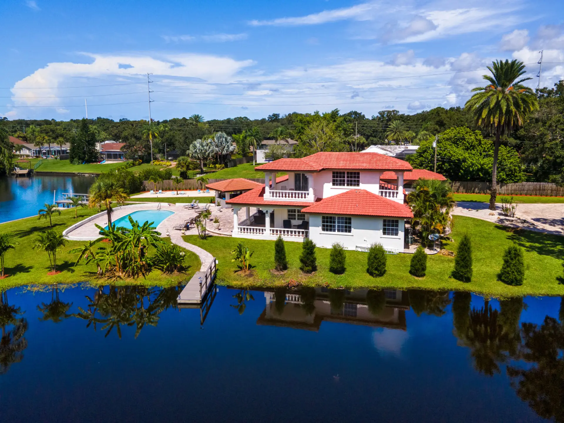 Aerial view of property and waterway