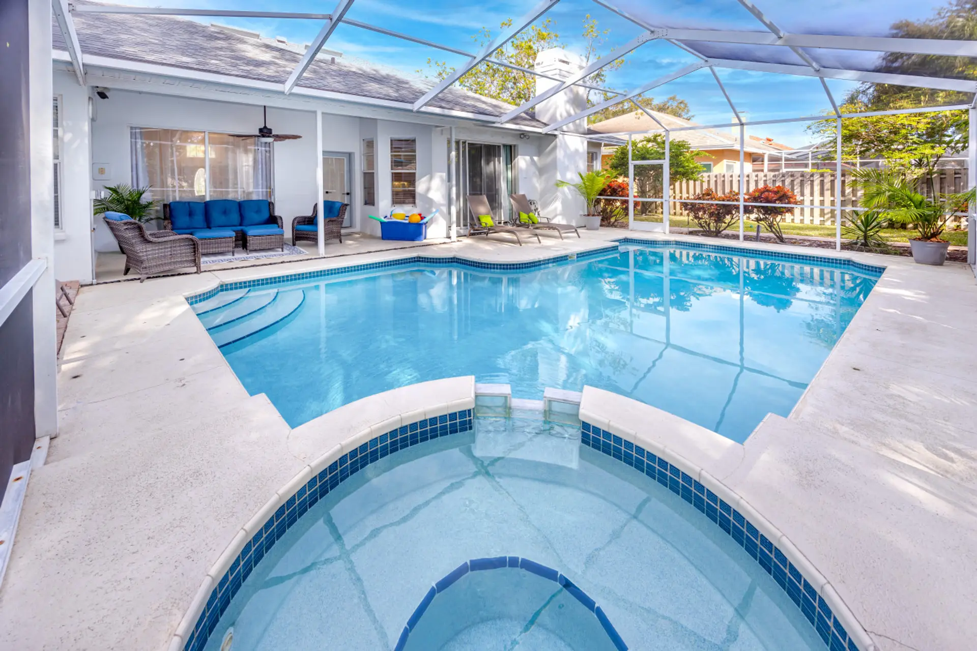 View of pool area and in-ground hot tub