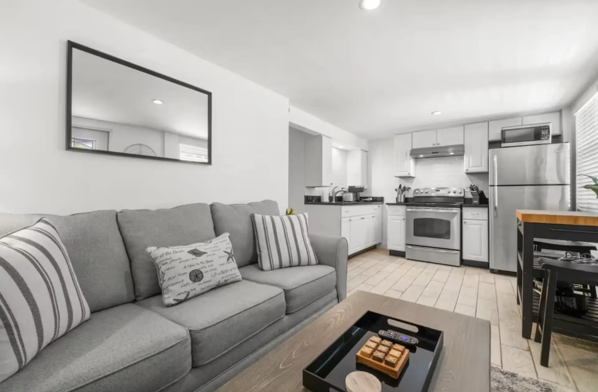 The living room sofa pulls out to a queen sleeper for additional guests
