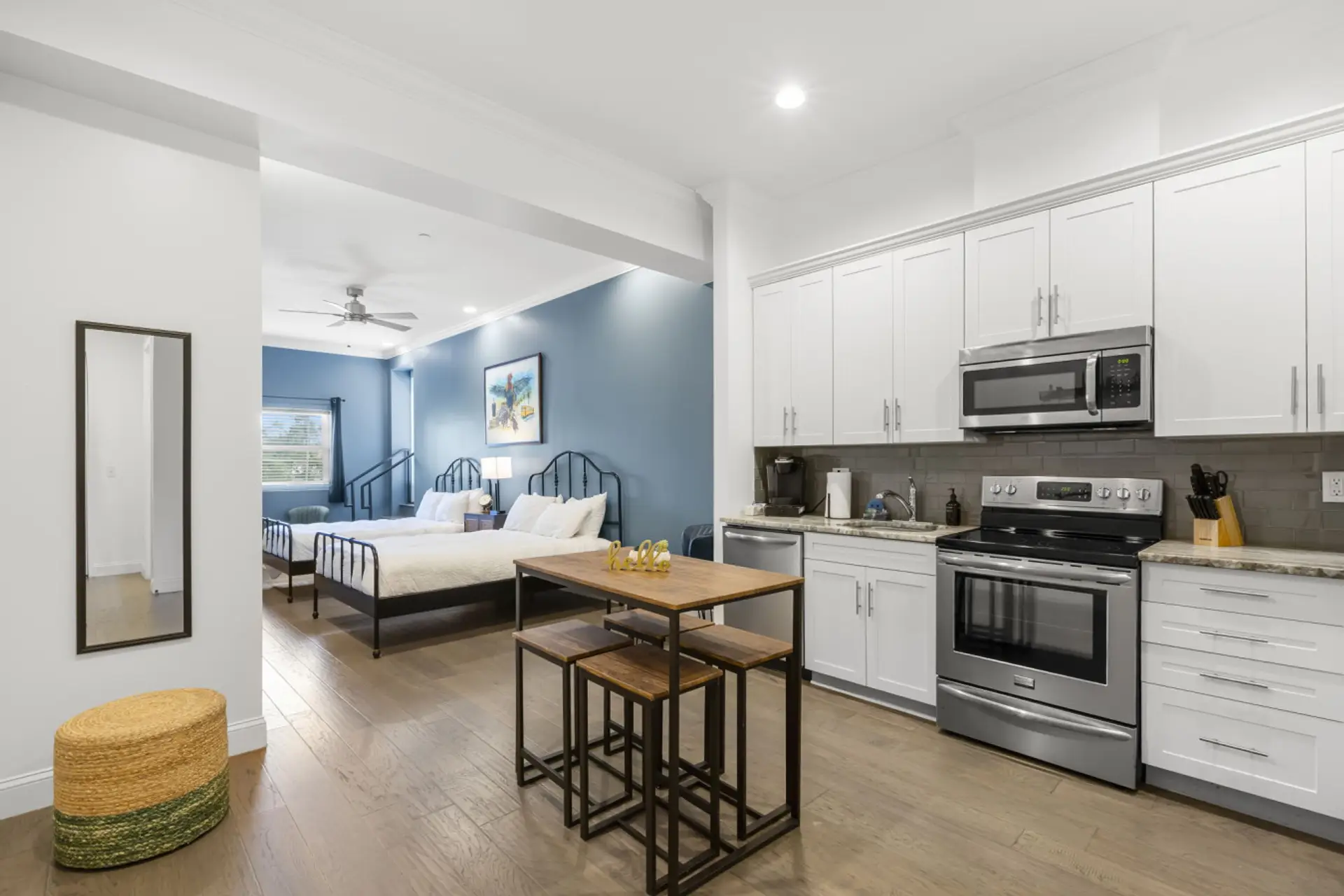 View of kitchen and dining area with seating for 4