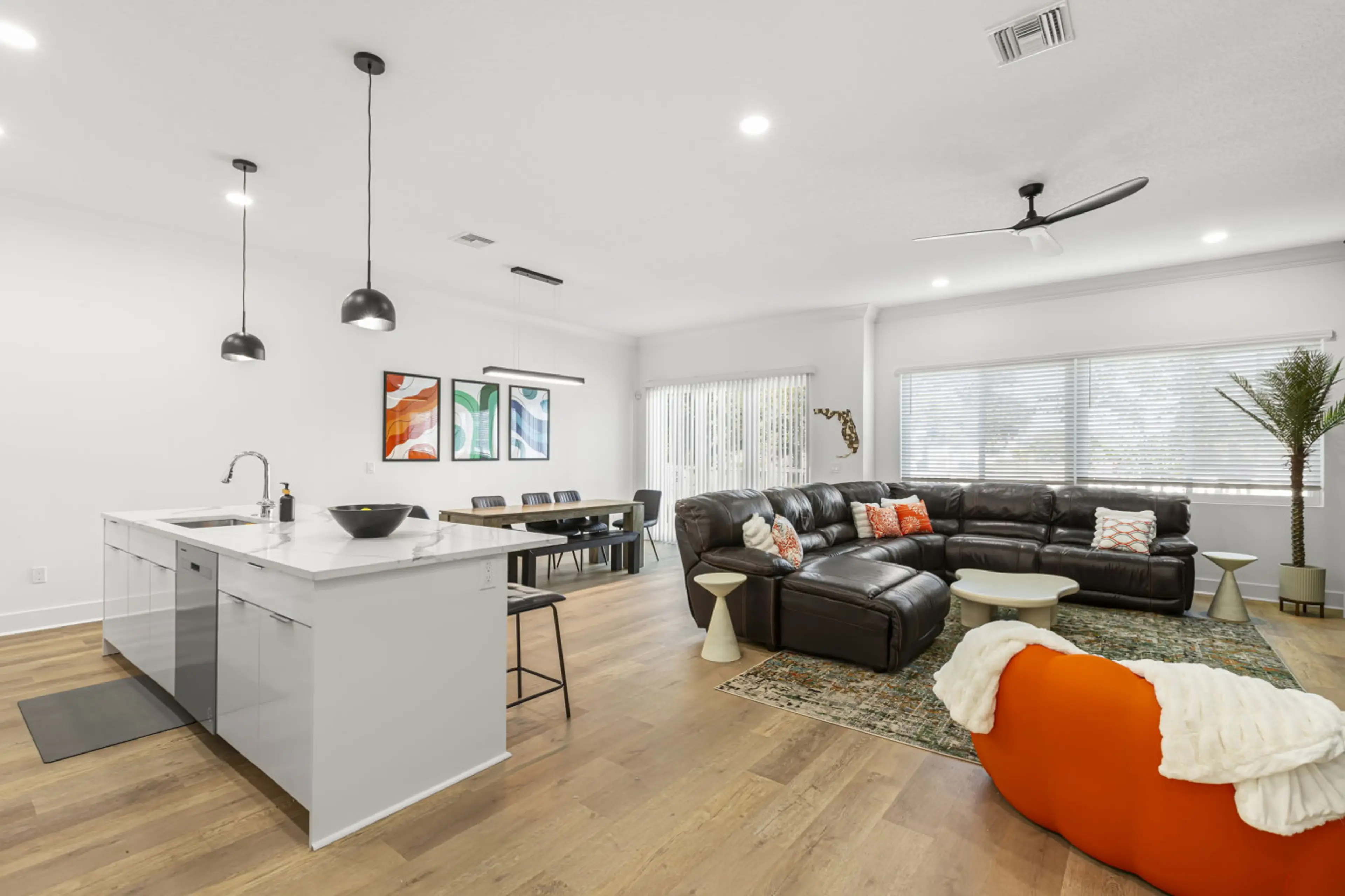 View of open layout with large windows, allowing for ample natural light