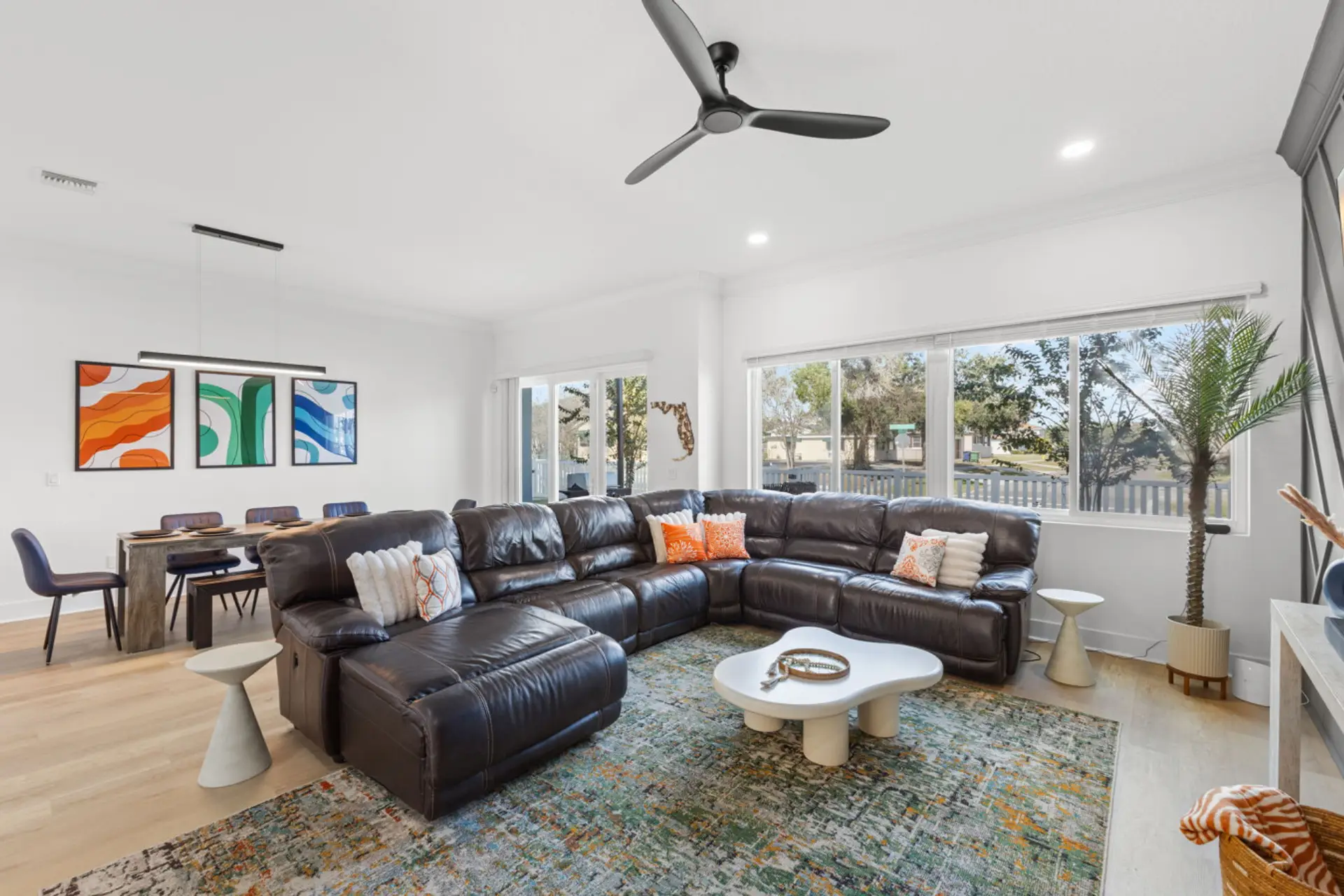 View of living and dining area with back patio access