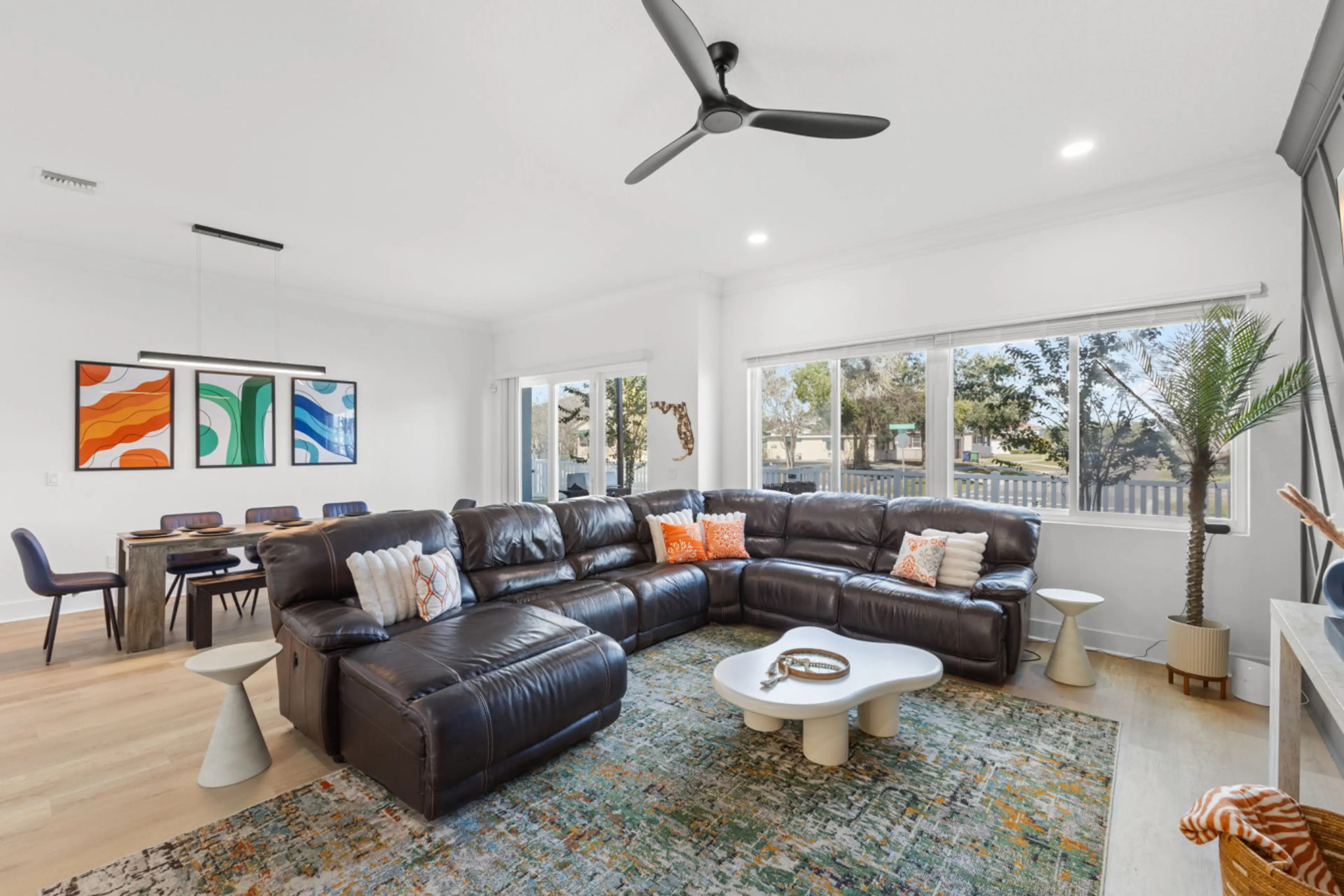 View of living and dining area with back patio access