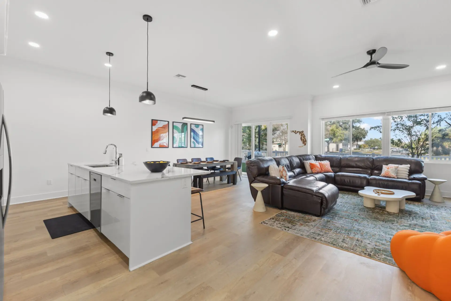 View of open layout with large windows, allowing for ample natural light