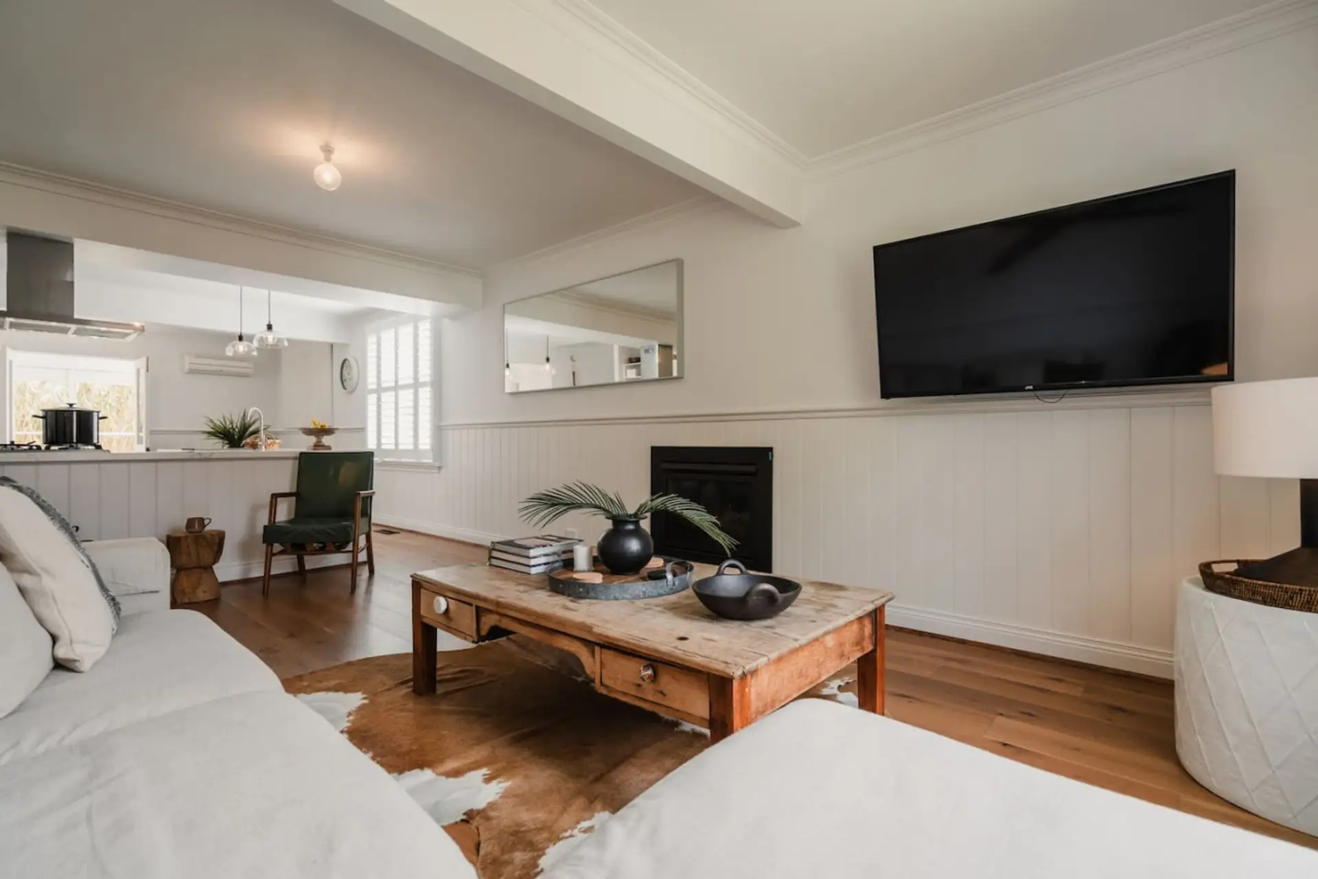 📺 Open living area flowing from kitchen with smart TV