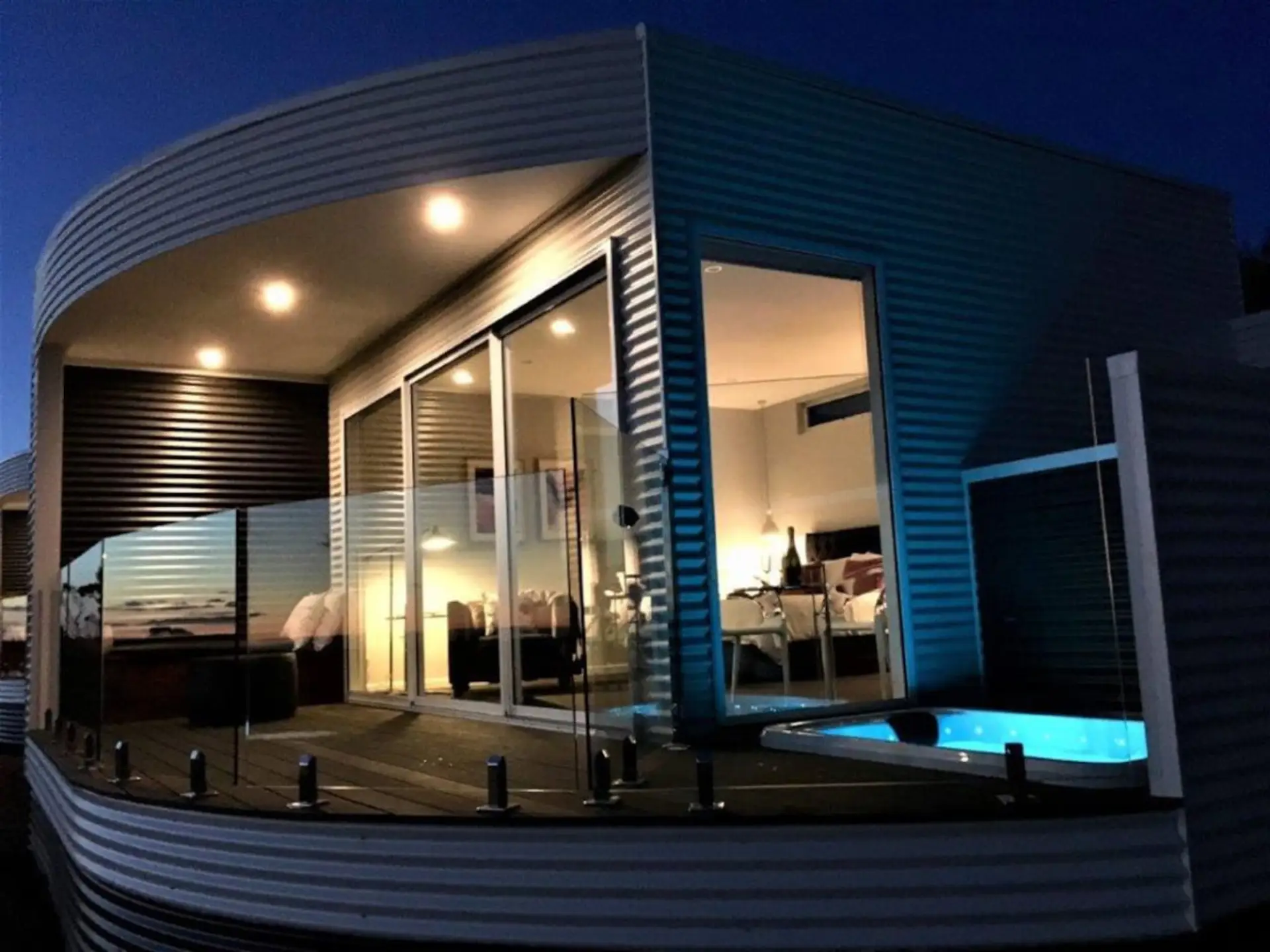 🌙 Private spa retreat with balcony and ambient evening lighting