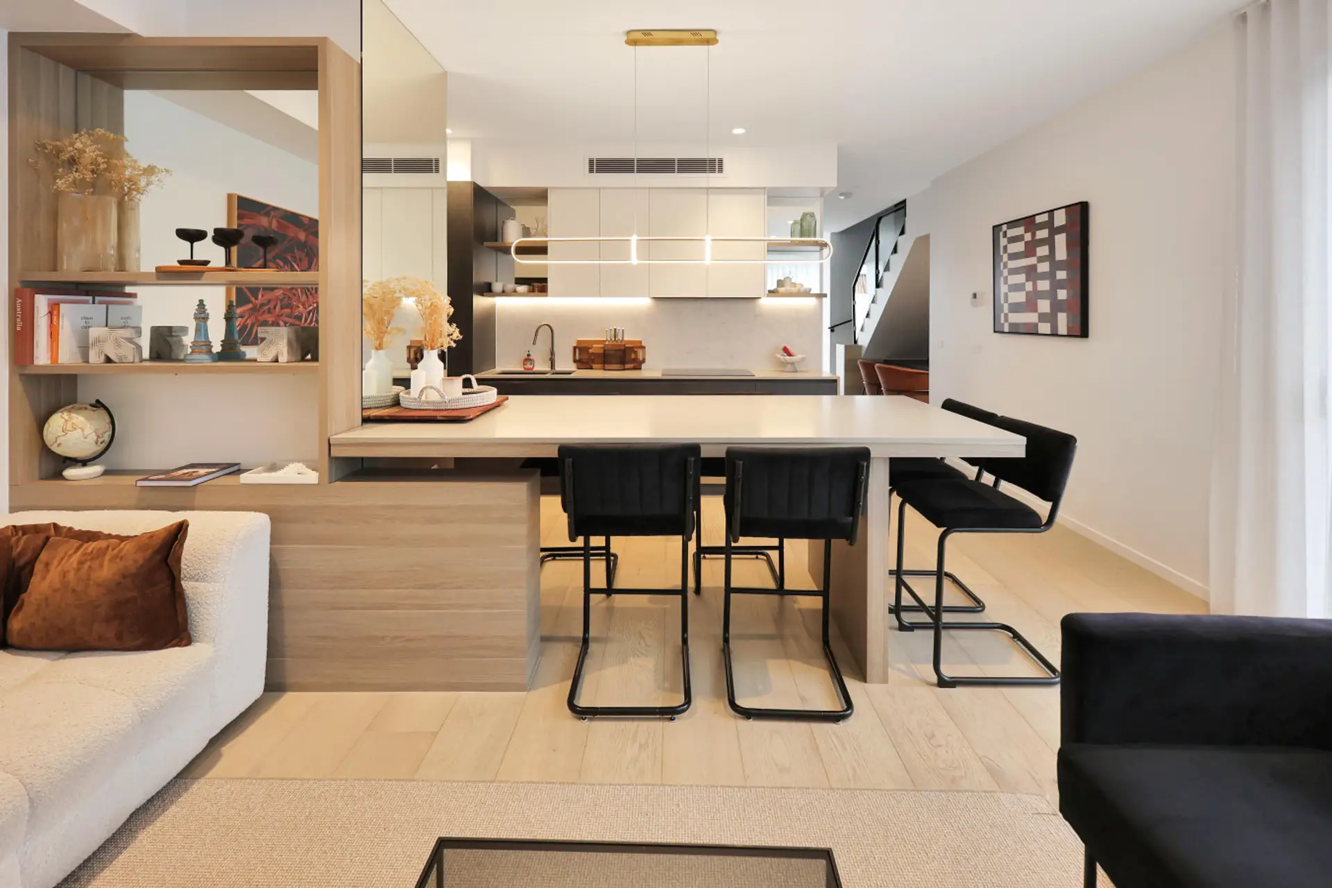 Stylish open kitchen and dining area with island seating and contemporary finishes
