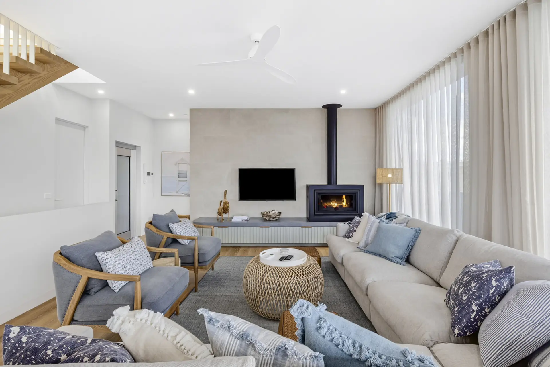 Spacious living area with cozy fireplace and elegant styling