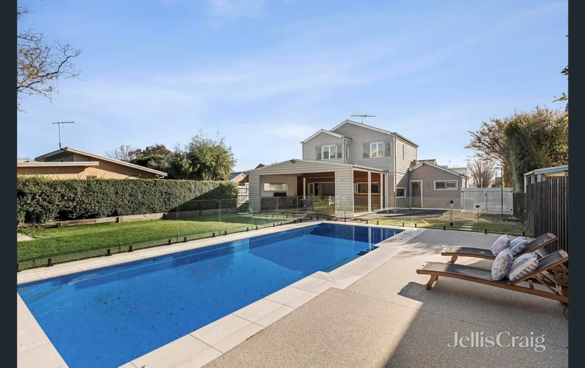 Private pool with sun loungers and spacious backyard