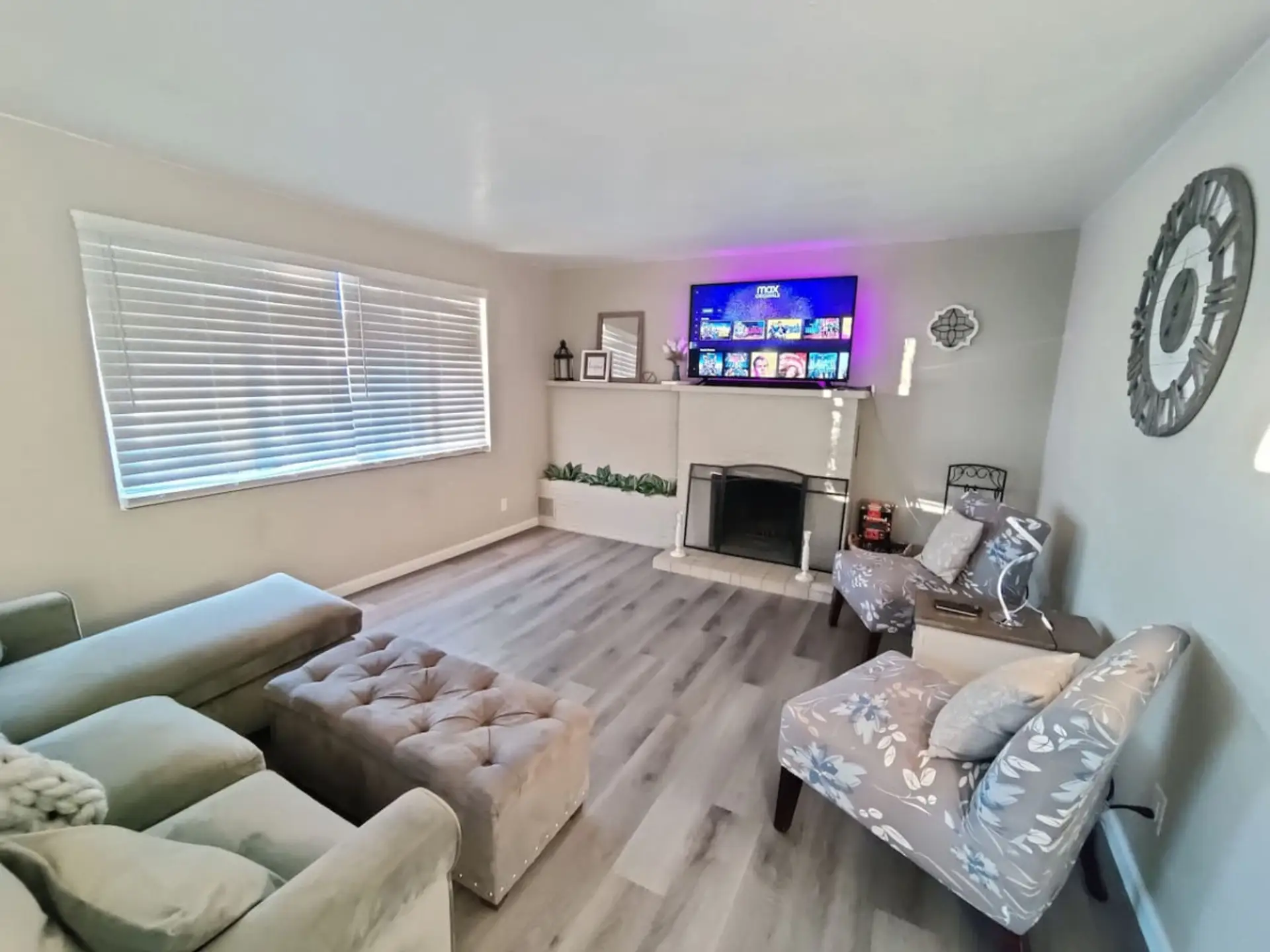 Comfortable living room with a wood fire place to keep you nice and cozy.